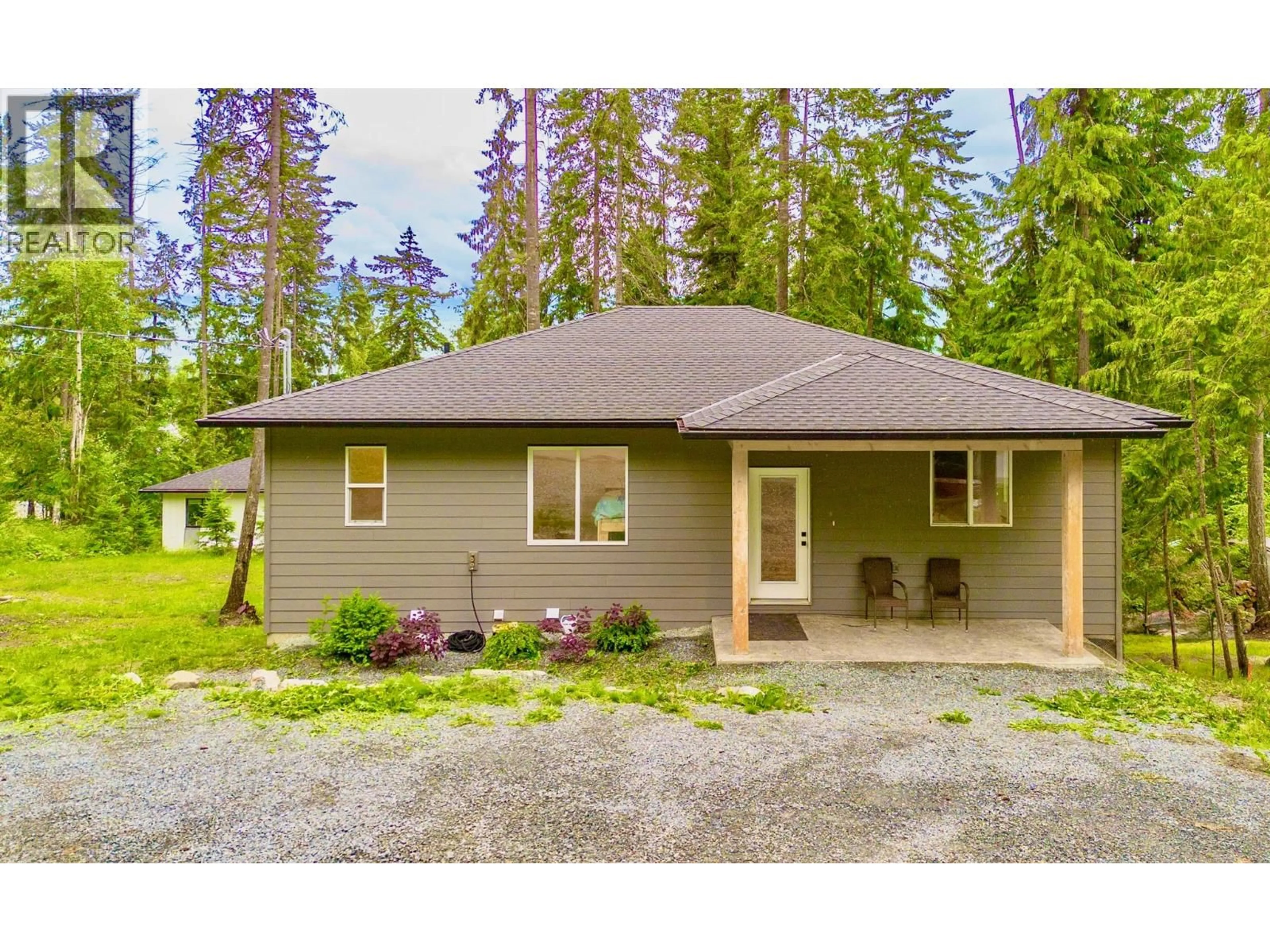 Home with vinyl exterior material, street for 7468 ESTATE DRIVE, Anglemont British Columbia V0E1M8