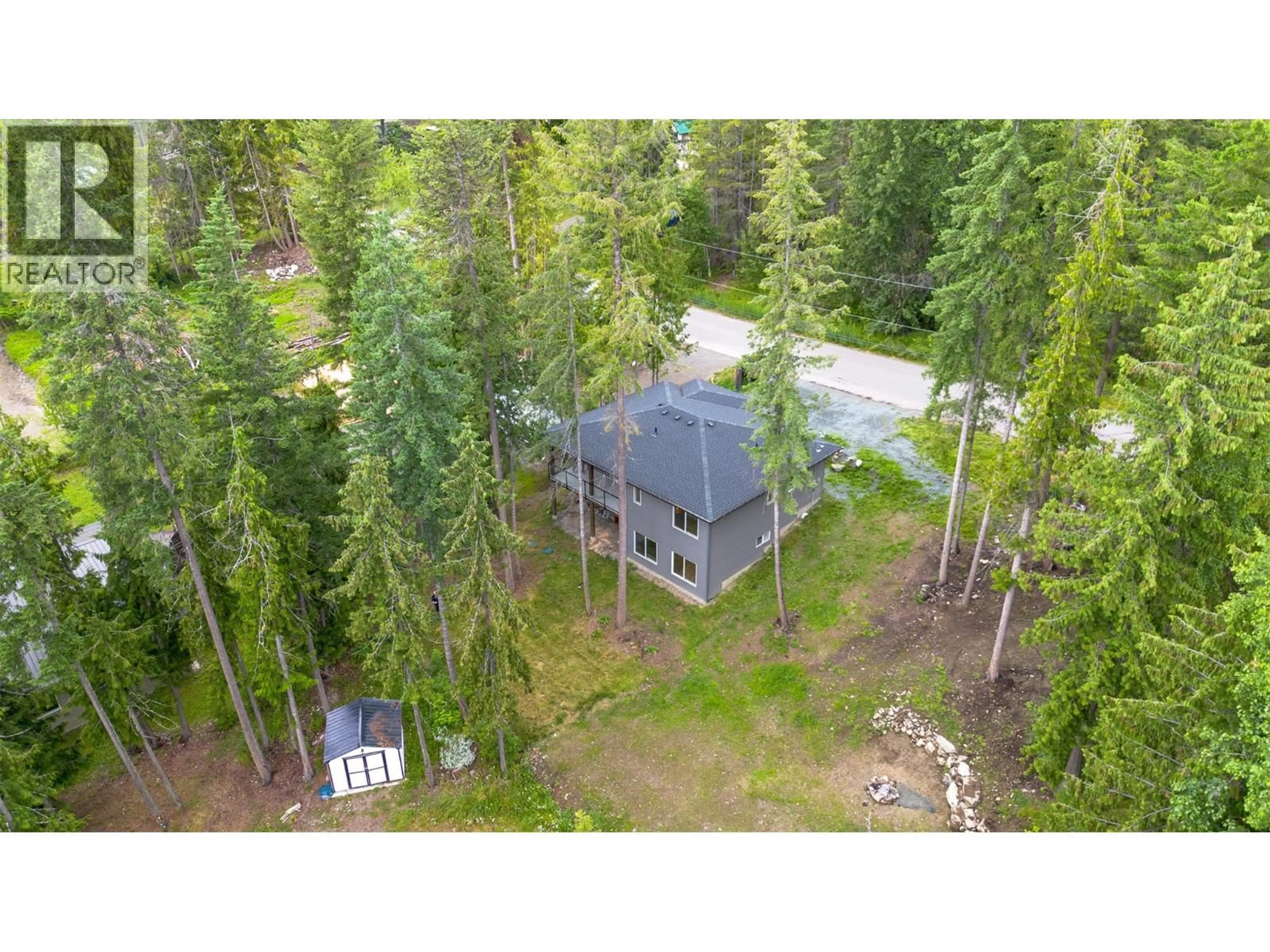 A pic from outside/outdoor area/front of a property/back of a property/a pic from drone, forest/trees view for 7468 ESTATE DRIVE, Anglemont British Columbia V0E1M8