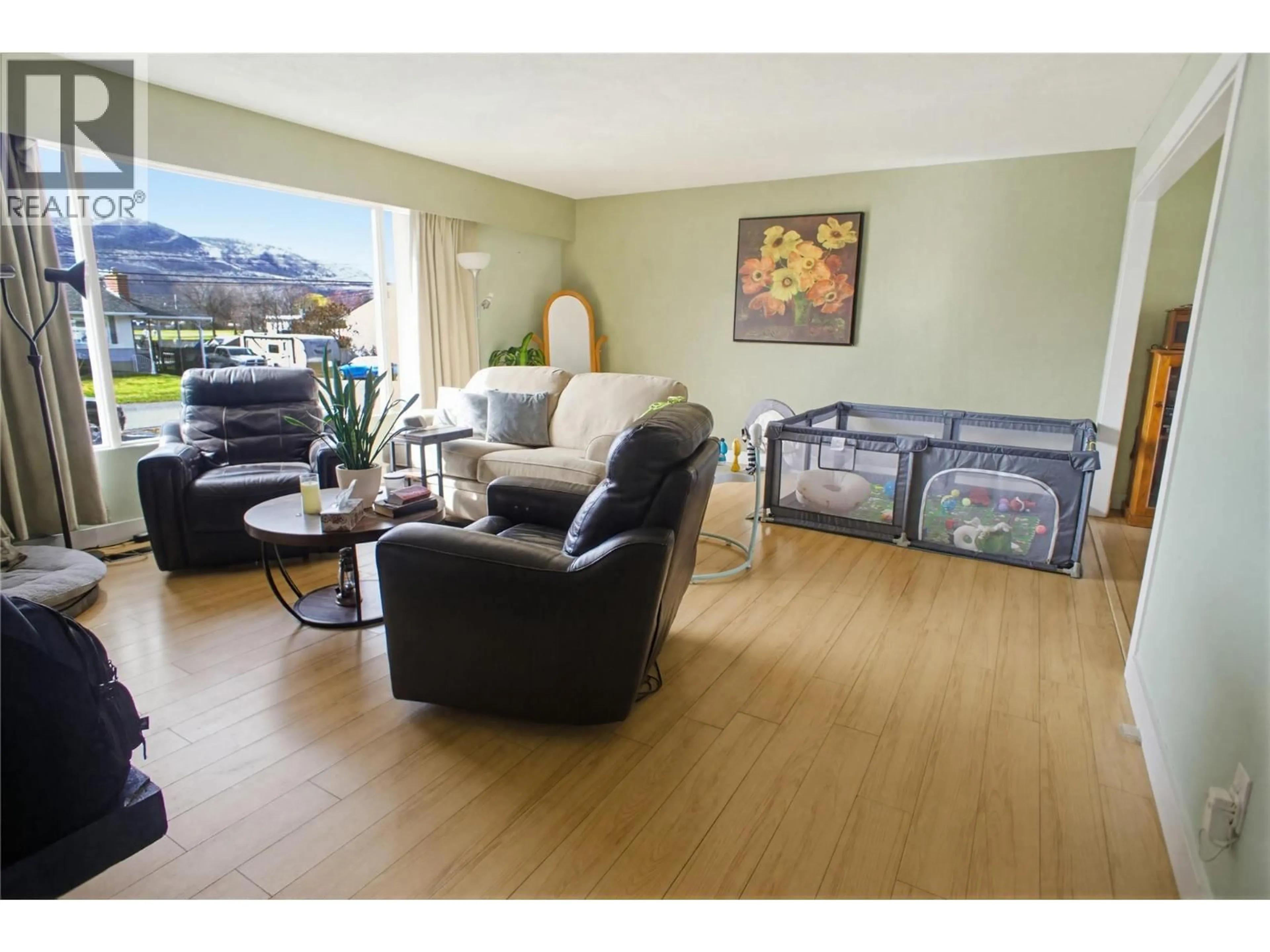 Living room with furniture, wood/laminate floor for 1942 FLEETWOOD AVENUE, Kamloops British Columbia V2B4S4