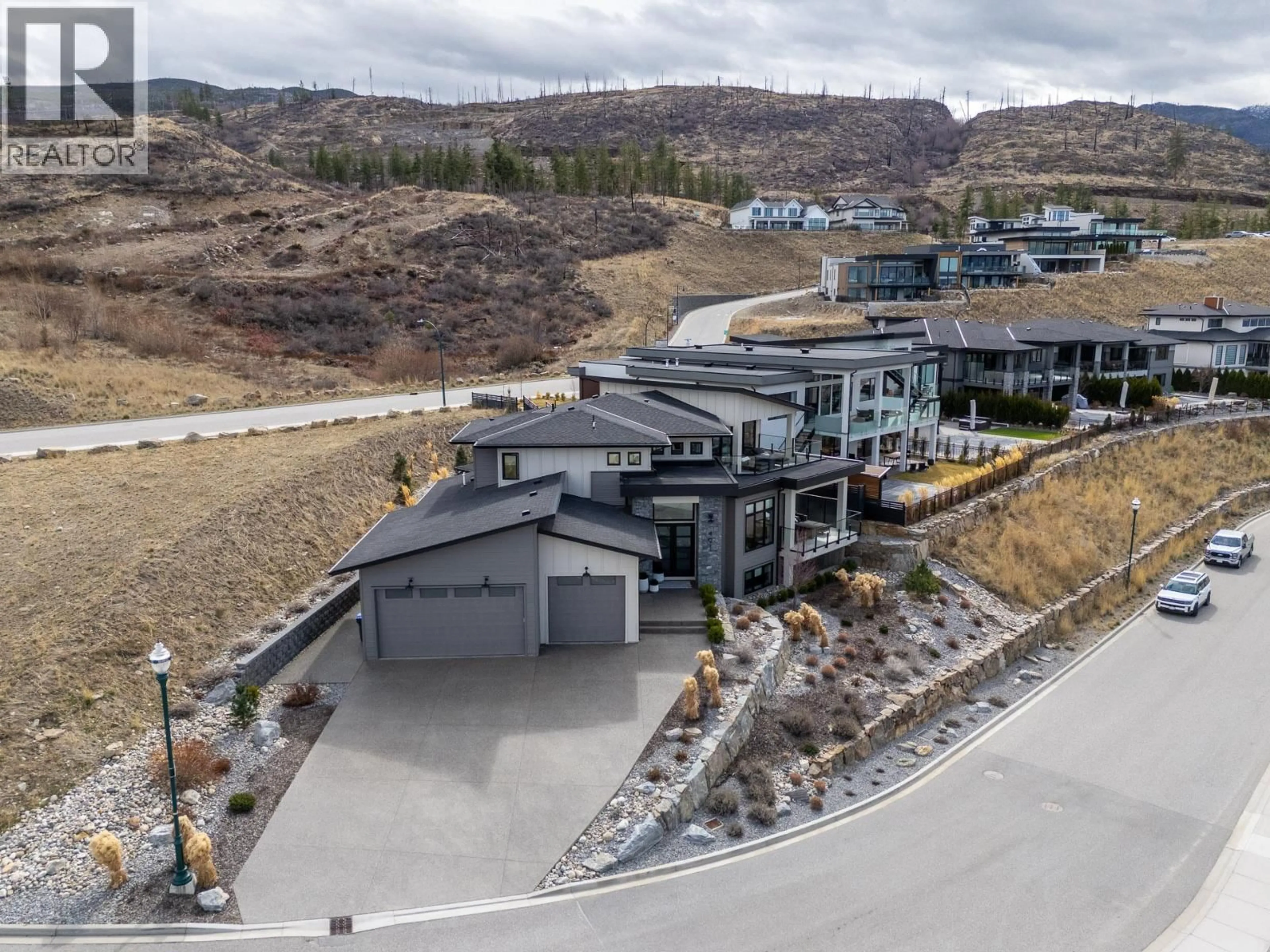 A pic from outside/outdoor area/front of a property/back of a property/a pic from drone, mountain view for 491 TRESTLE RIDGE DRIVE, Kelowna British Columbia V1W5M3