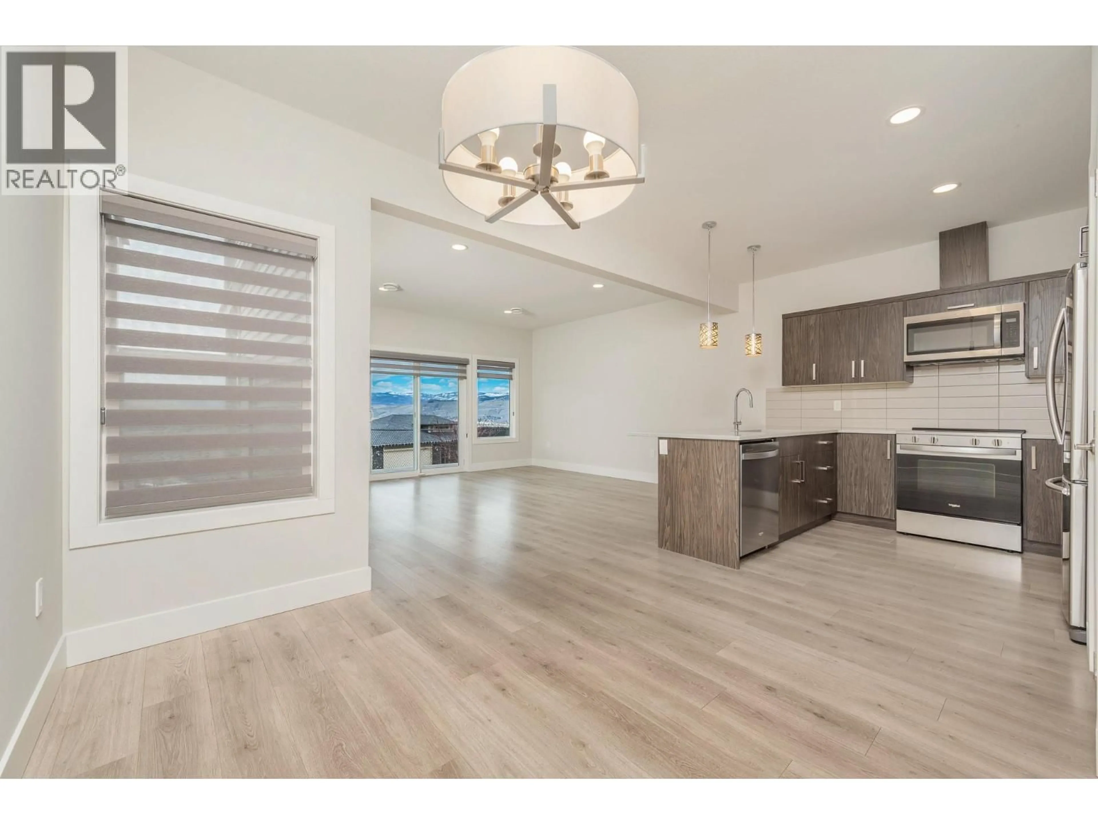 Open concept kitchen, wood/laminate floor for 97 - 933 MT ROBSON PLACE, Vernon British Columbia V1B4G4