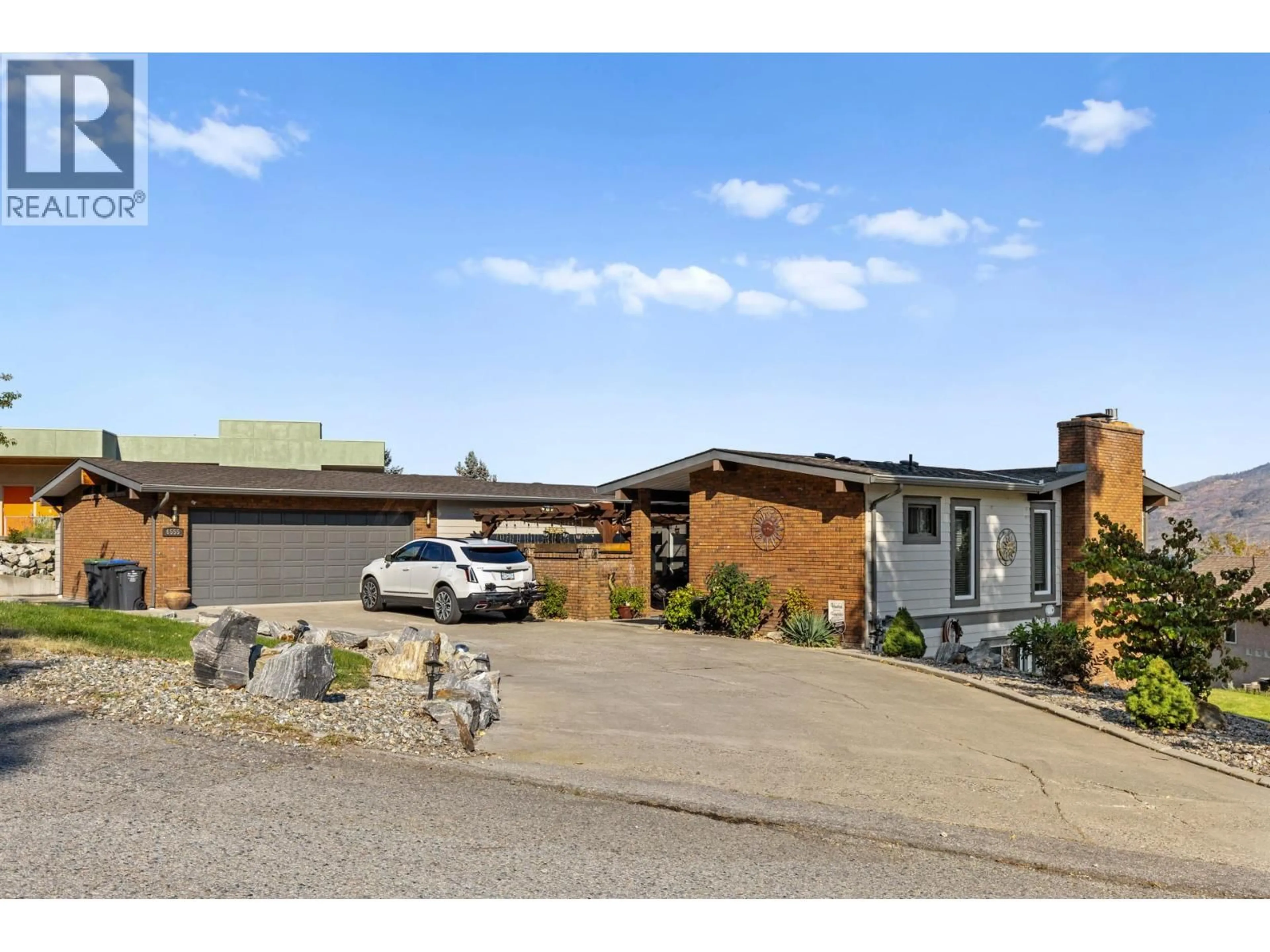 A pic from outside/outdoor area/front of a property/back of a property/a pic from drone, street for 6555 SHERBURN ROAD, Peachland British Columbia V0H1X7