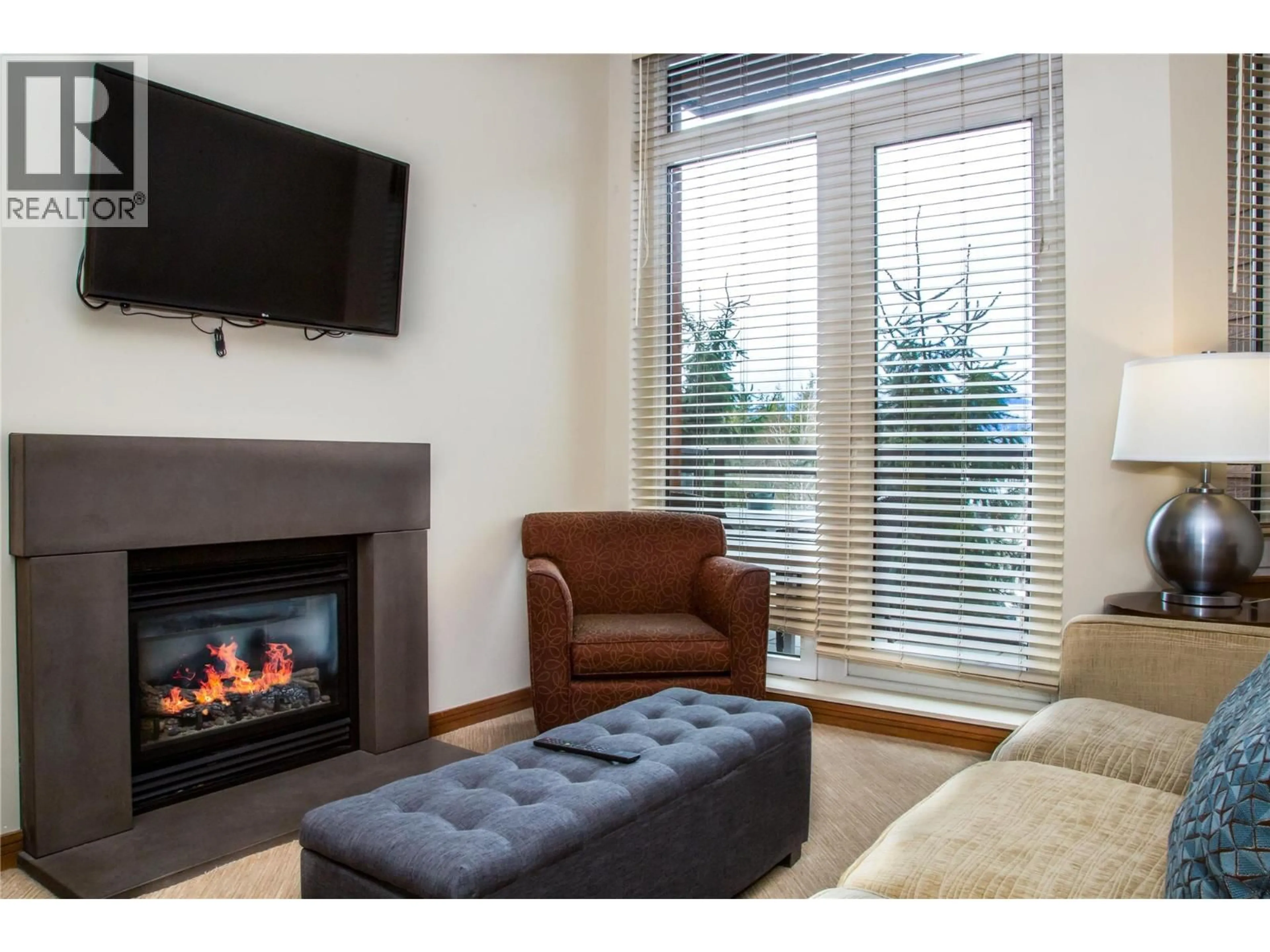 Living room with furniture, wood/laminate floor for 1212 - 2950 CAMOZZI ROAD, Revelstoke British Columbia V0E2S1