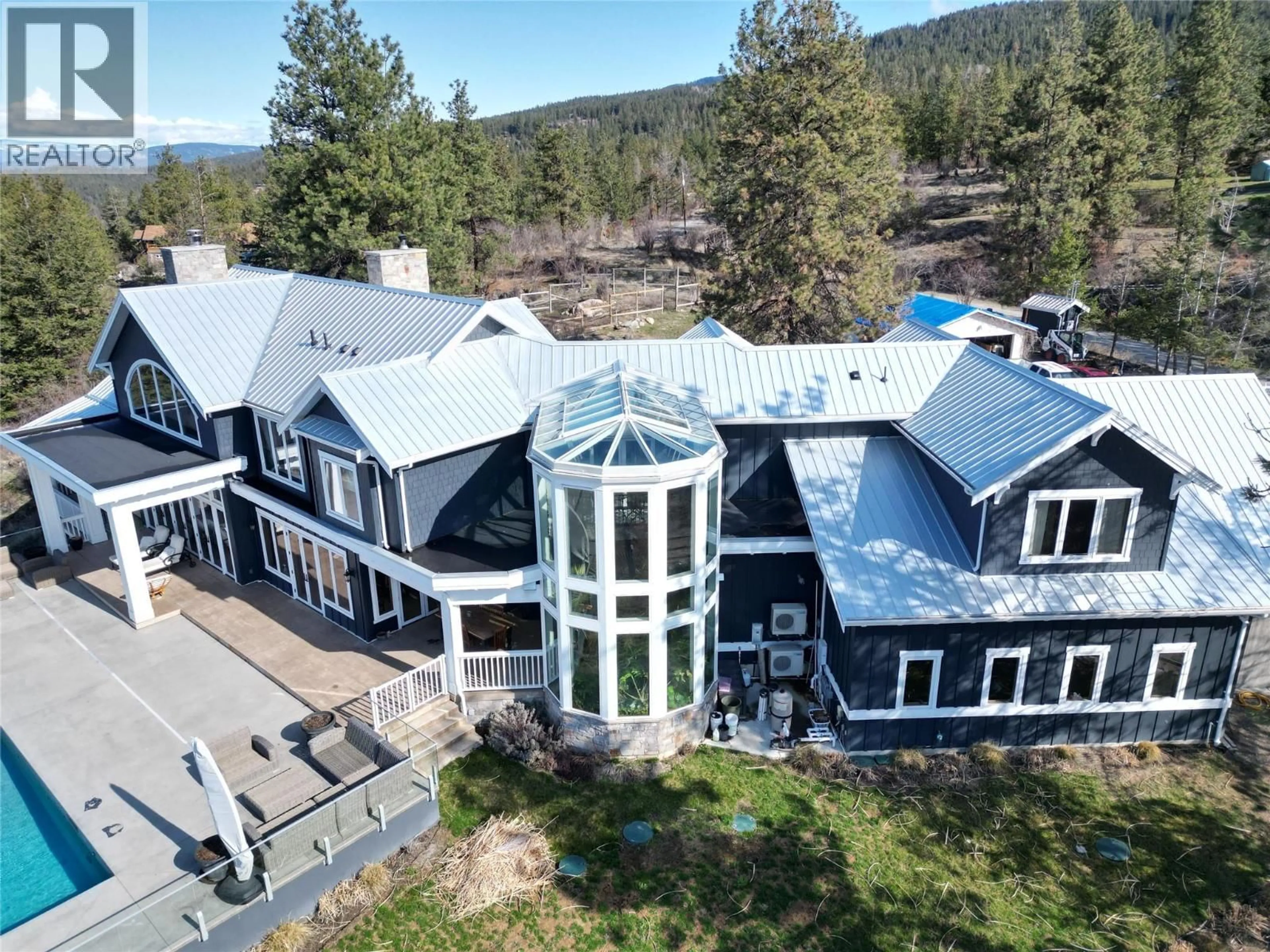 A pic from outside/outdoor area/front of a property/back of a property/a pic from drone, mountain view for 5474 DEADPINE DRIVE, Kelowna British Columbia V1P1A3