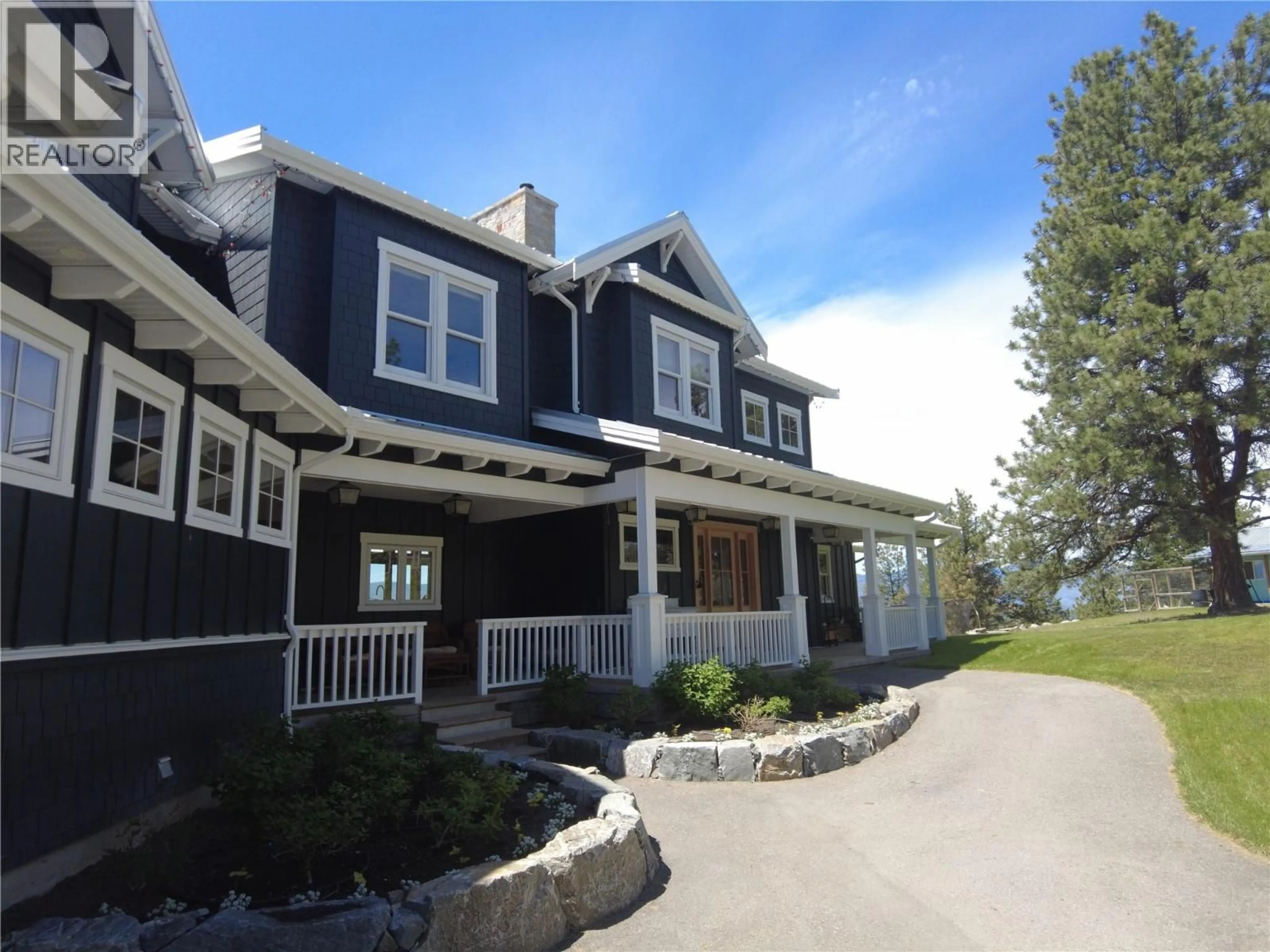 Home with vinyl exterior material, street for 5474 DEADPINE DRIVE, Kelowna British Columbia V1P1A3