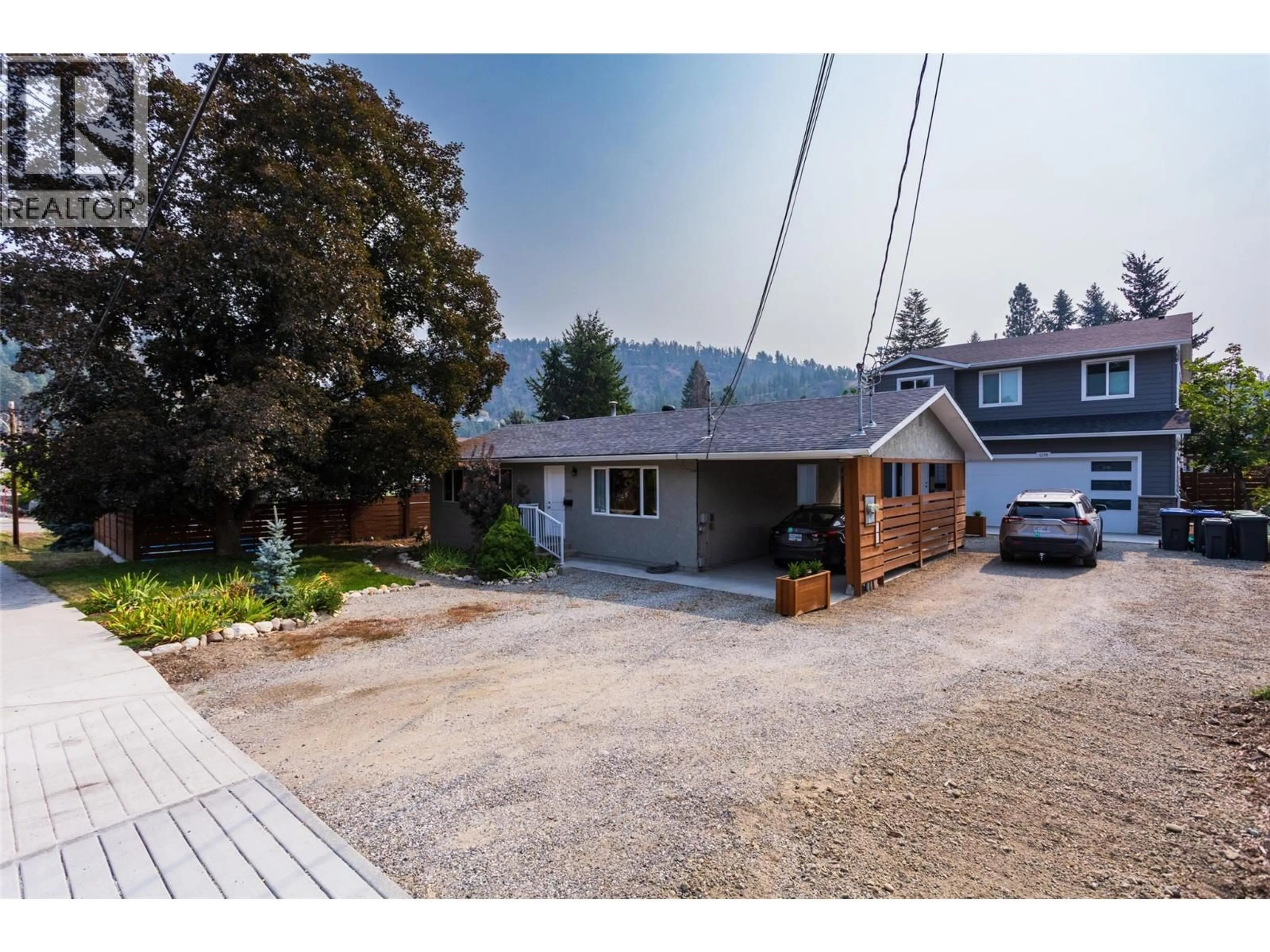 A pic from outside/outdoor area/front of a property/back of a property/a pic from drone, unknown for 1257 RIO DRIVE, Kelowna British Columbia V1V1E2