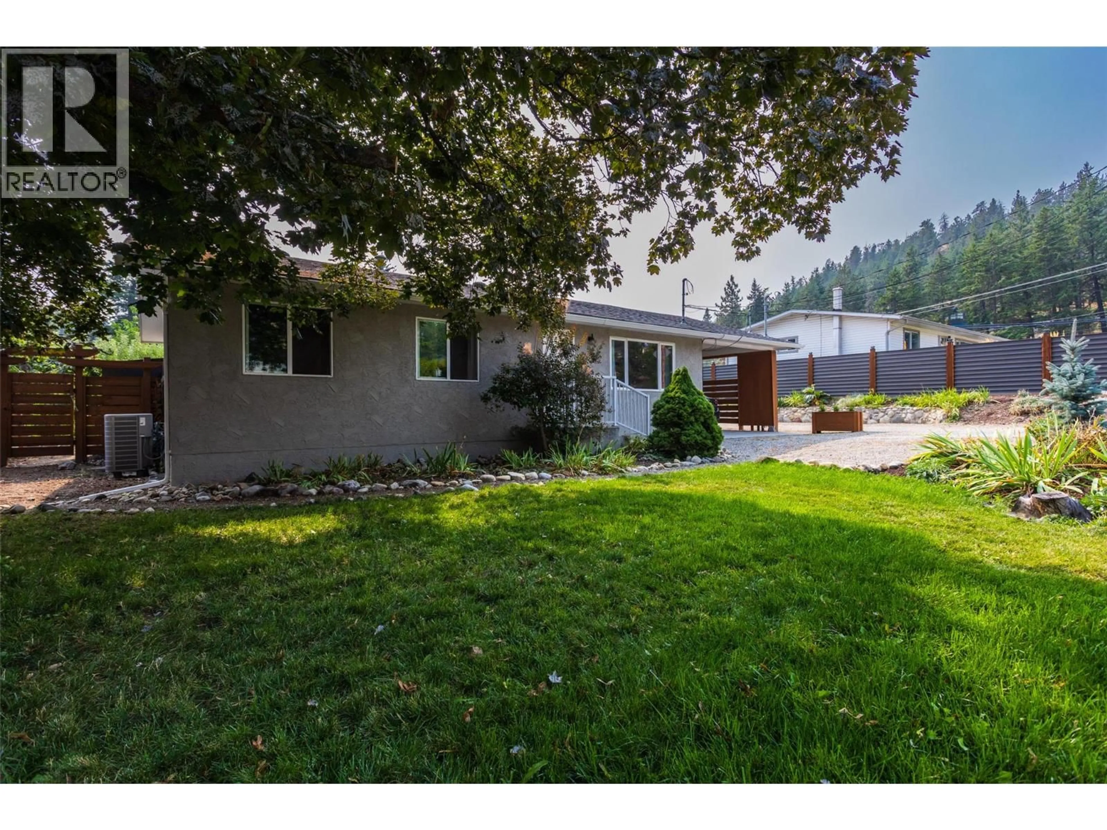 A pic from outside/outdoor area/front of a property/back of a property/a pic from drone, unknown for 1257 RIO DRIVE, Kelowna British Columbia V1V1E2