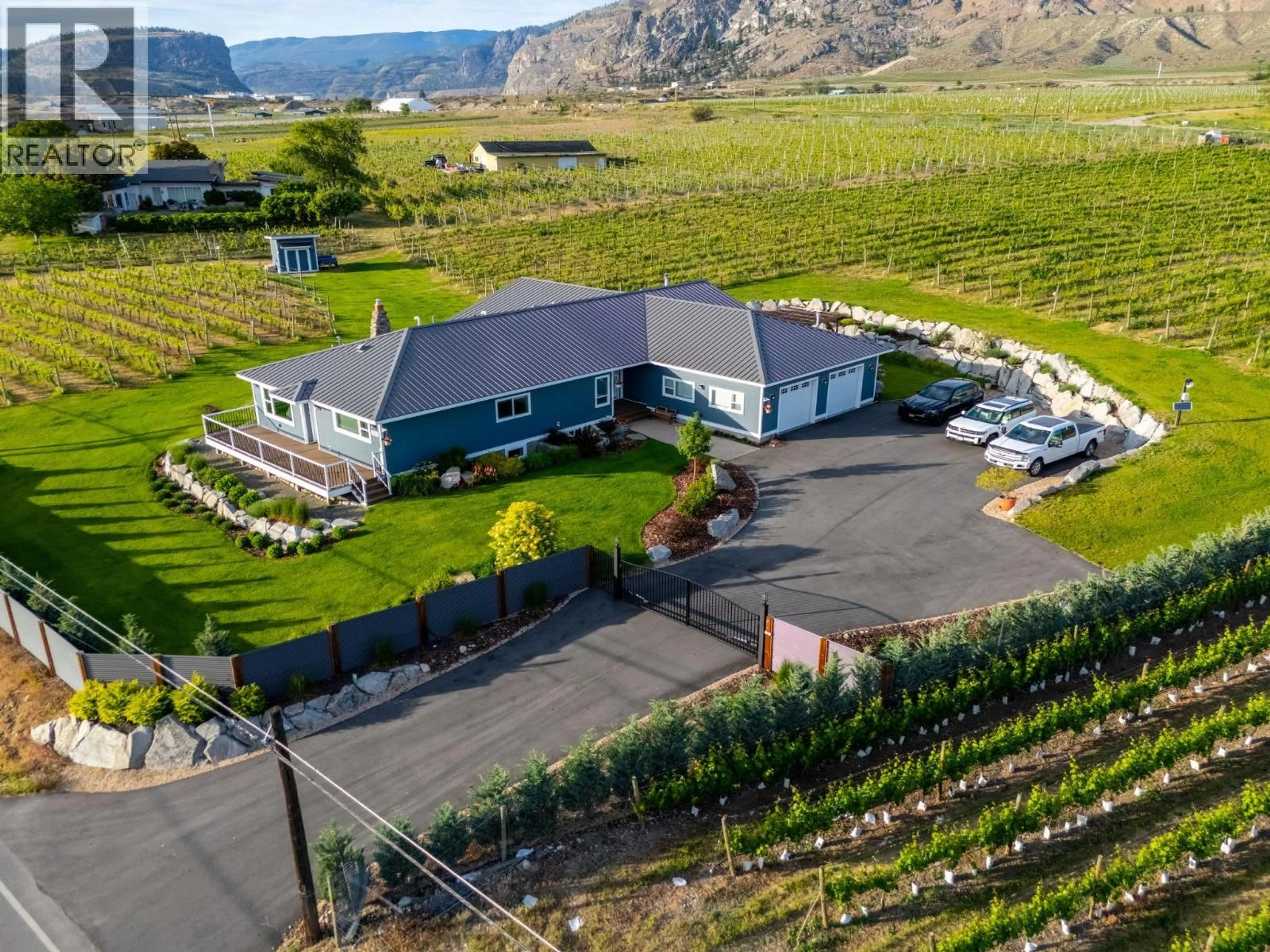 A pic from outside/outdoor area/front of a property/back of a property/a pic from drone, mountain view for 7207 TUCELNUIT DRIVE, Oliver British Columbia V0H1T2