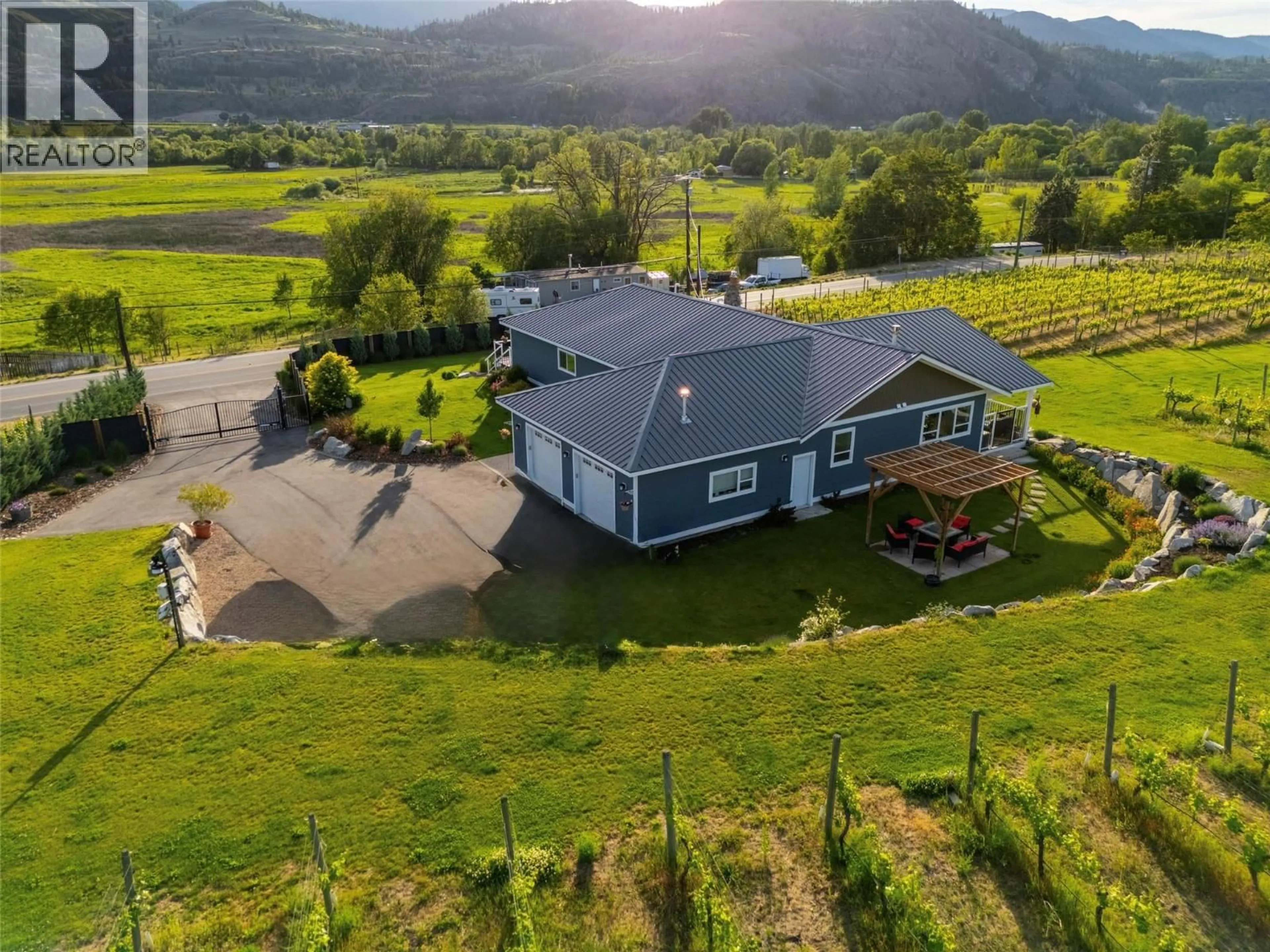 A pic from outside/outdoor area/front of a property/back of a property/a pic from drone, mountain view for 7207 TUCELNUIT DRIVE, Oliver British Columbia V0H1T2