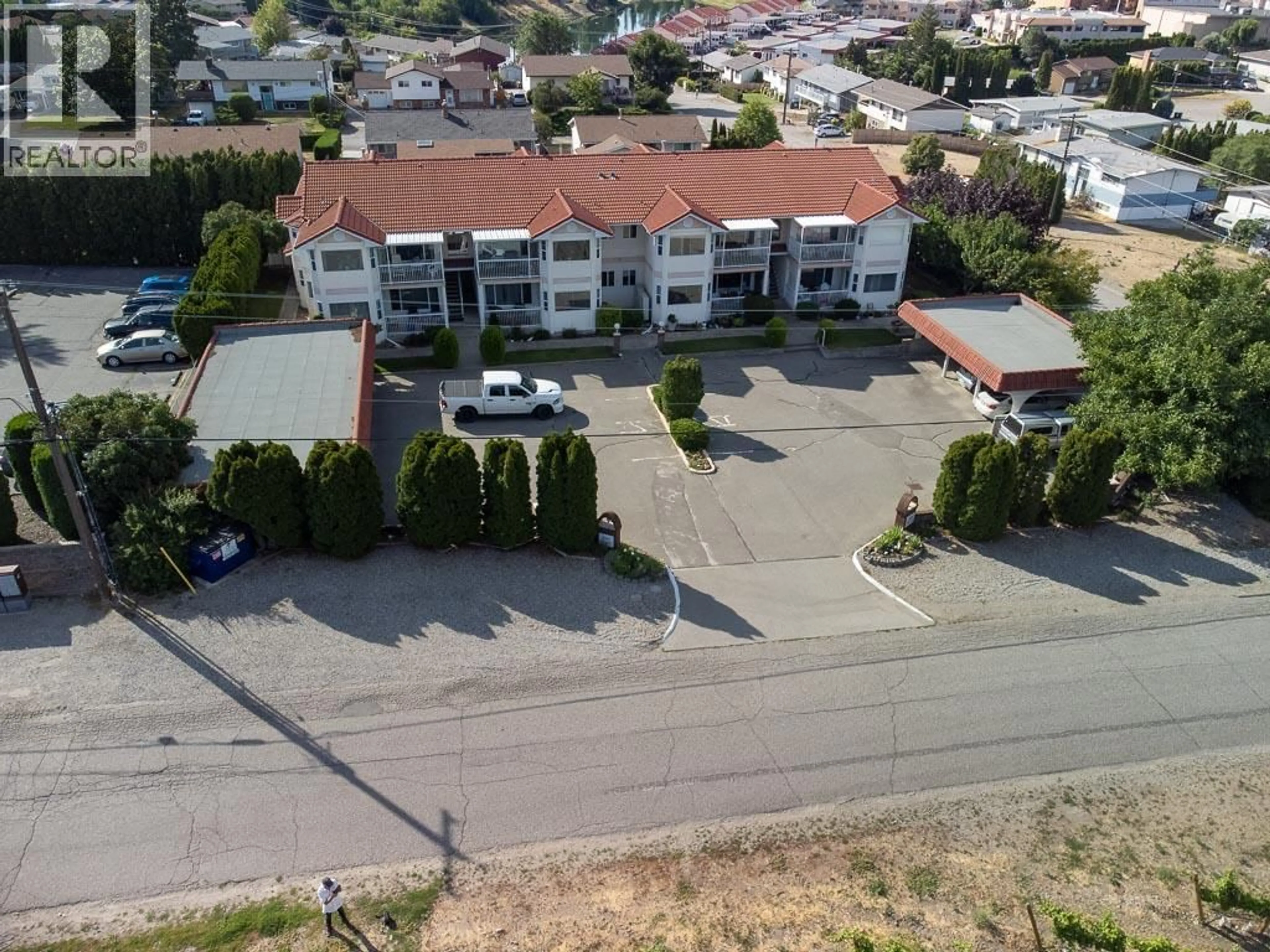 A pic from outside/outdoor area/front of a property/back of a property/a pic from drone, street for 101 - 8911 92ND AVENUE, Osoyoos British Columbia V0H1V2