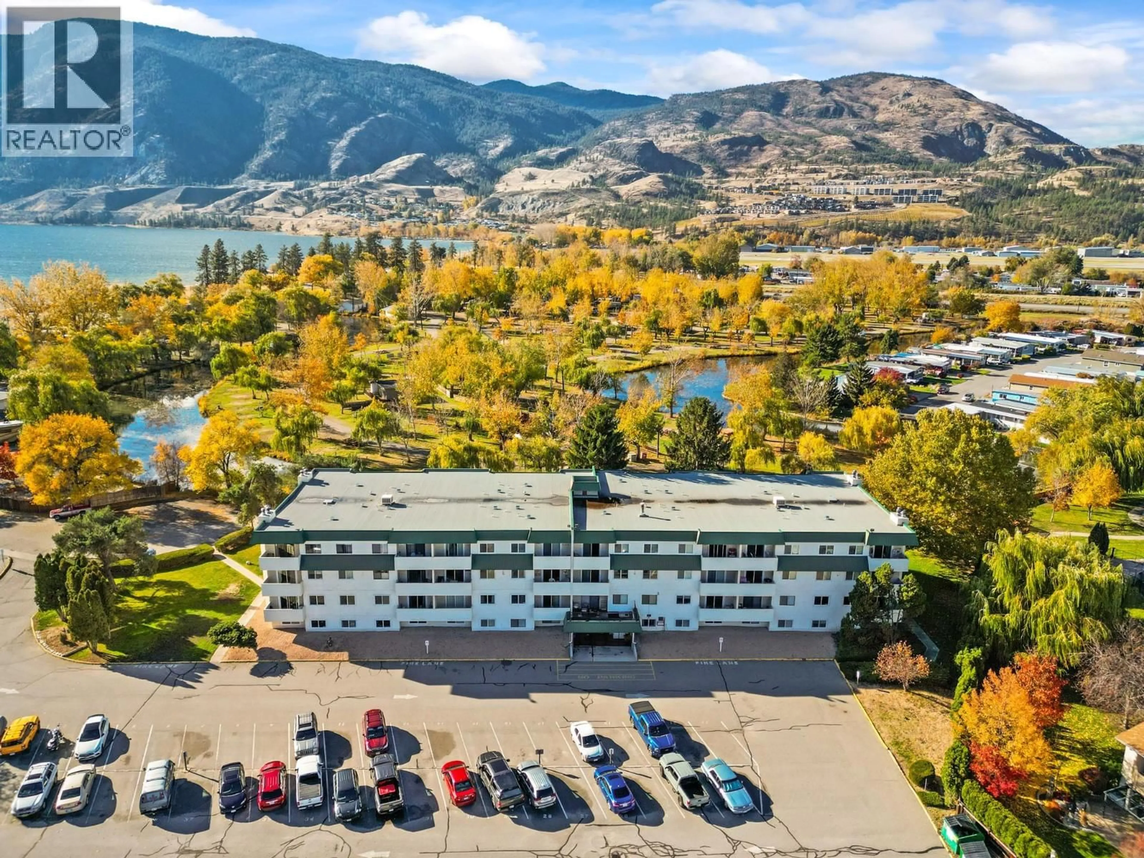 A pic from outside/outdoor area/front of a property/back of a property/a pic from drone, water/lake/river/ocean view for 408 - 150 SKAHA PLACE, Penticton British Columbia V2A7K1