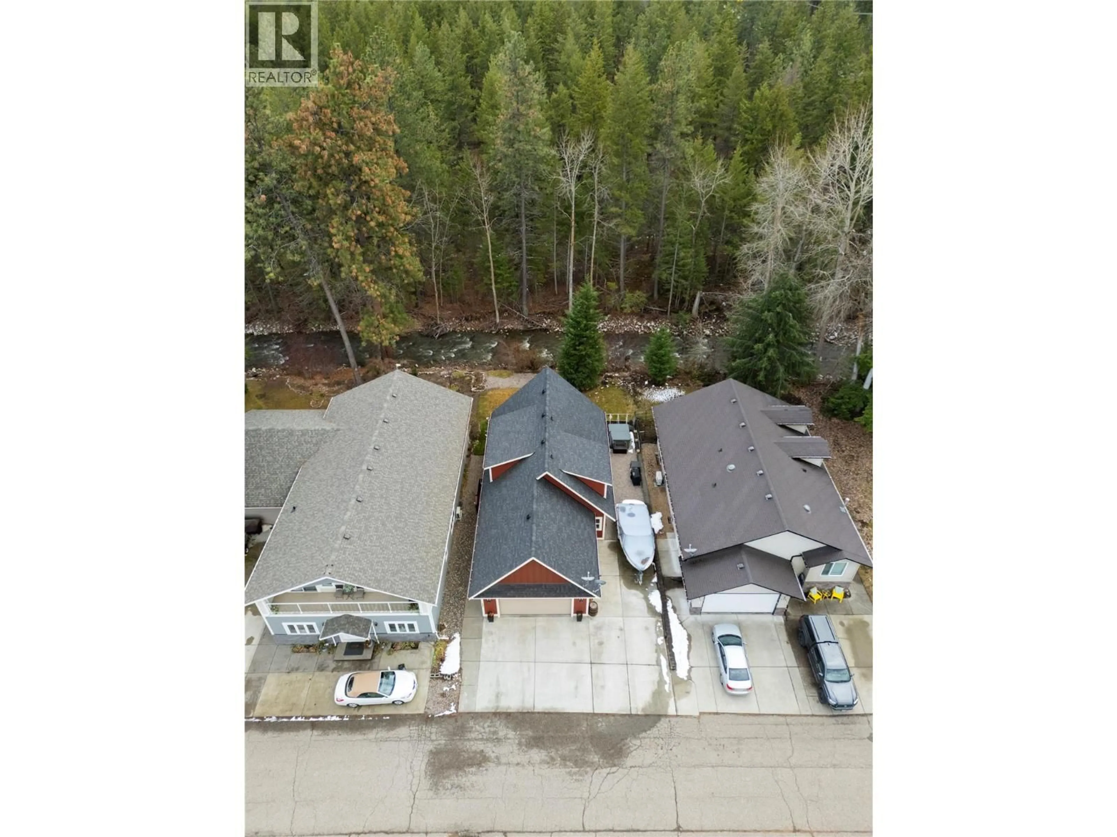 A pic from outside/outdoor area/front of a property/back of a property/a pic from drone, forest/trees view for 132 FALCON AVENUE, Vernon British Columbia V1H2A1