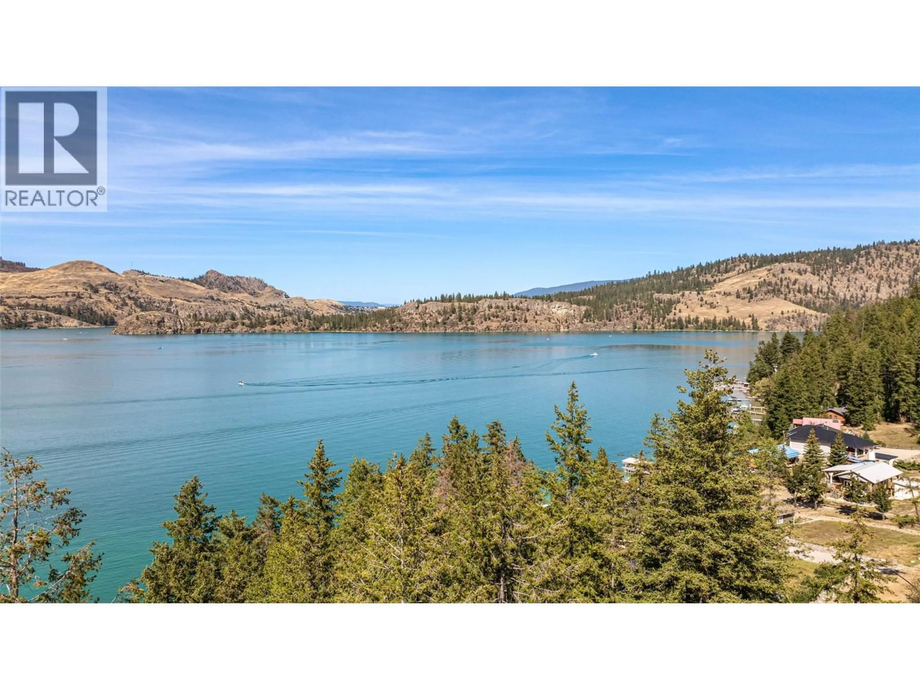 A pic from outside/outdoor area/front of a property/back of a property/a pic from drone, water/lake/river/ocean view for 5799 COSENS BAY ROAD, Coldstream British Columbia V1B1N8