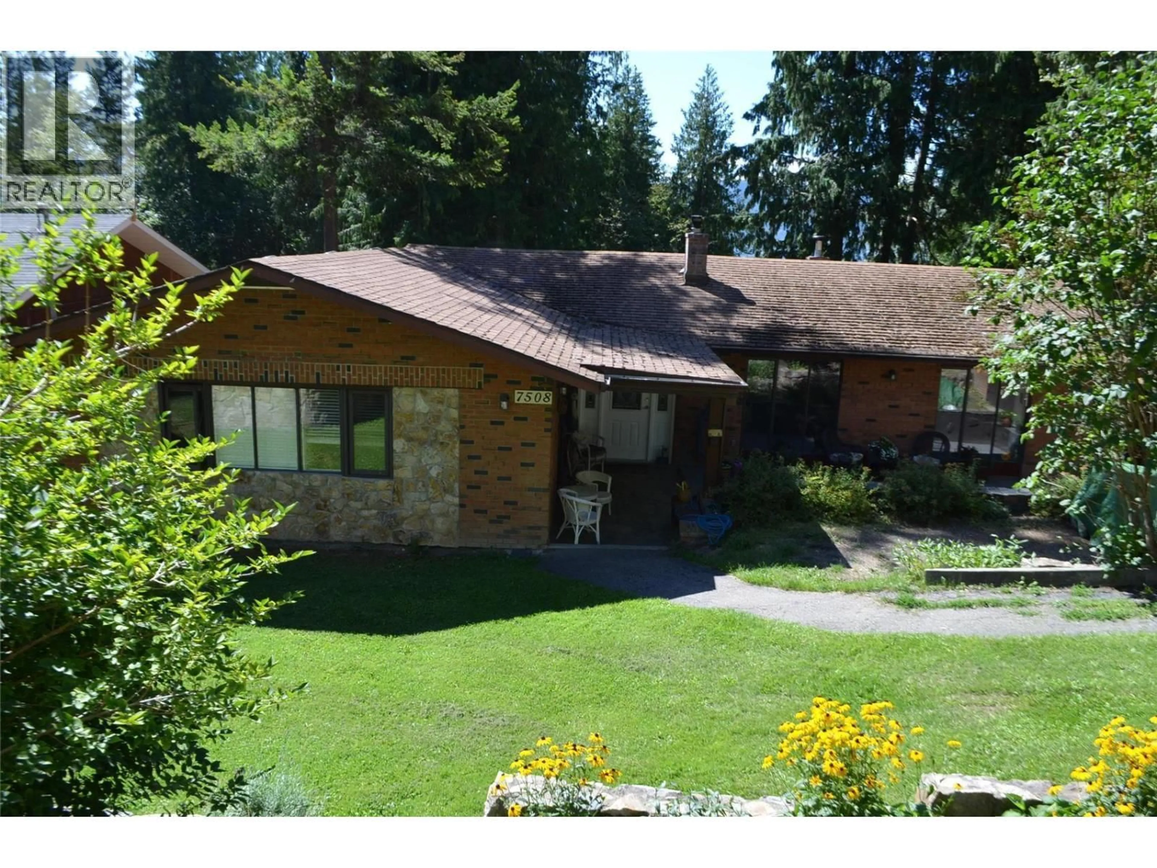 A pic from outside/outdoor area/front of a property/back of a property/a pic from drone, mountain view for 7508 CROWFOOT DRIVE, Anglemont British Columbia V0E1M8