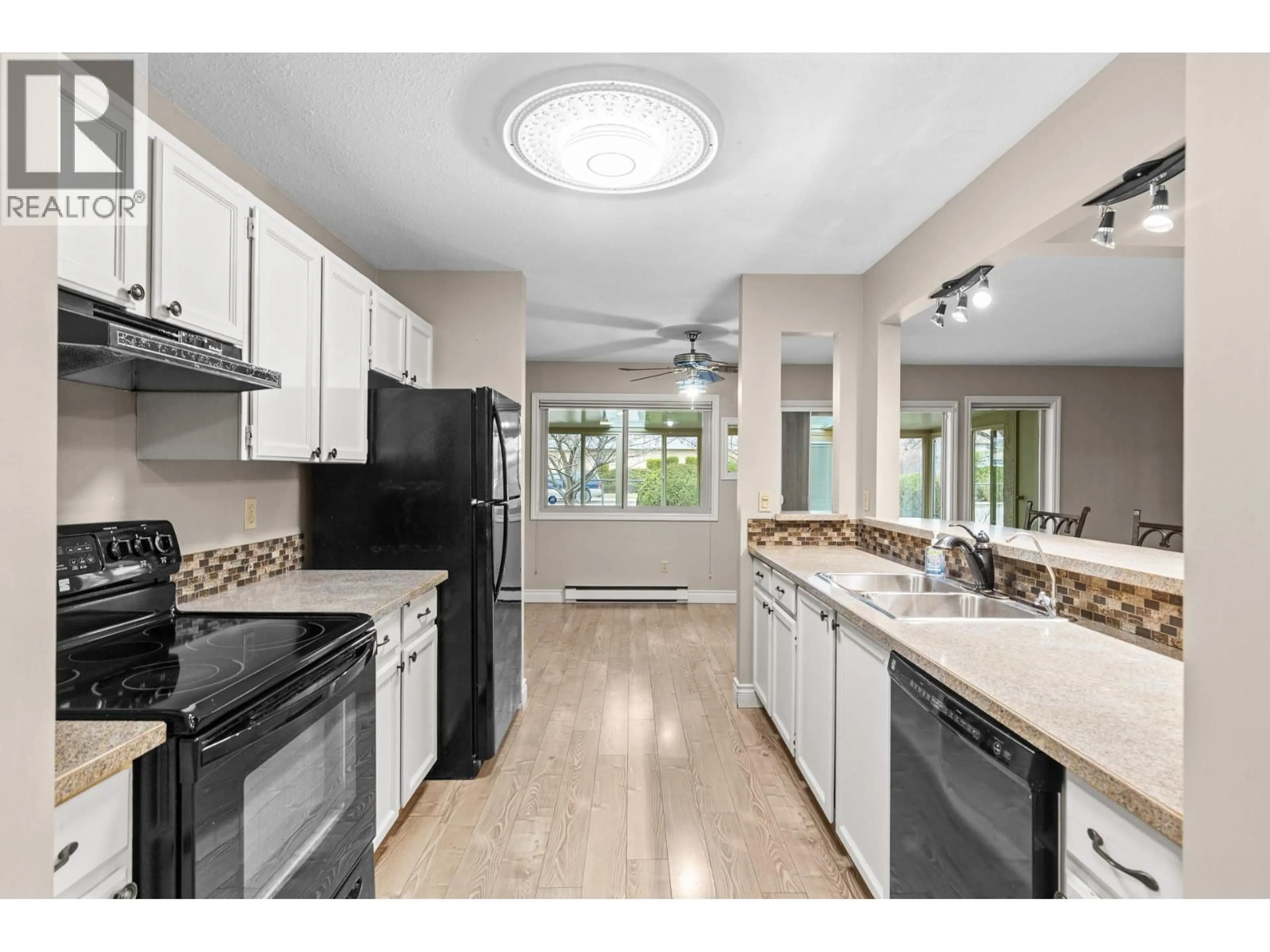 Open concept kitchen, ceramic/tile floor for 16 - 200 GERSTMAR ROAD, Kelowna British Columbia V1X4A7