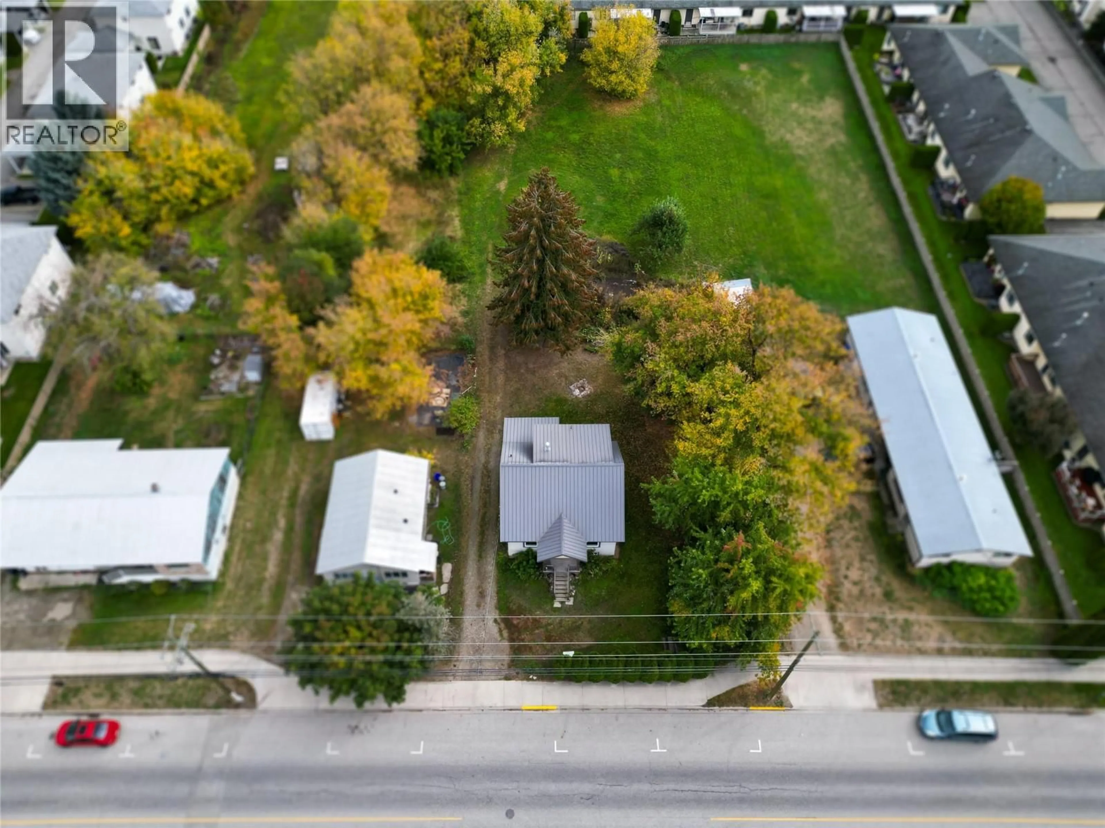A pic from outside/outdoor area/front of a property/back of a property/a pic from drone, street for 710 10 STREET SOUTHWEST, Salmon Arm British Columbia V1E1T2