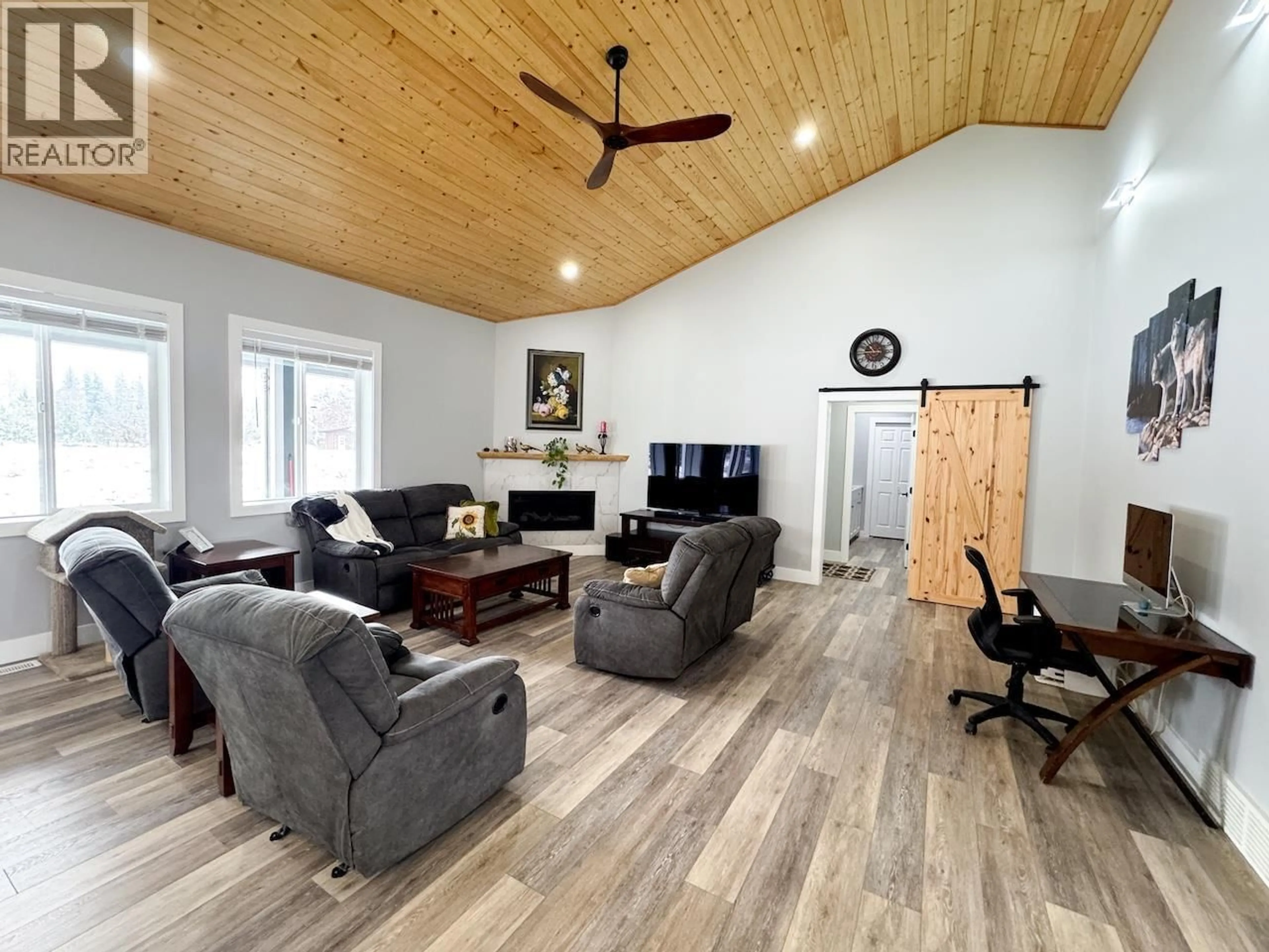 Living room with furniture, wood/laminate floor for 6560 25TH STREET, Grand Forks British Columbia V0H1H0