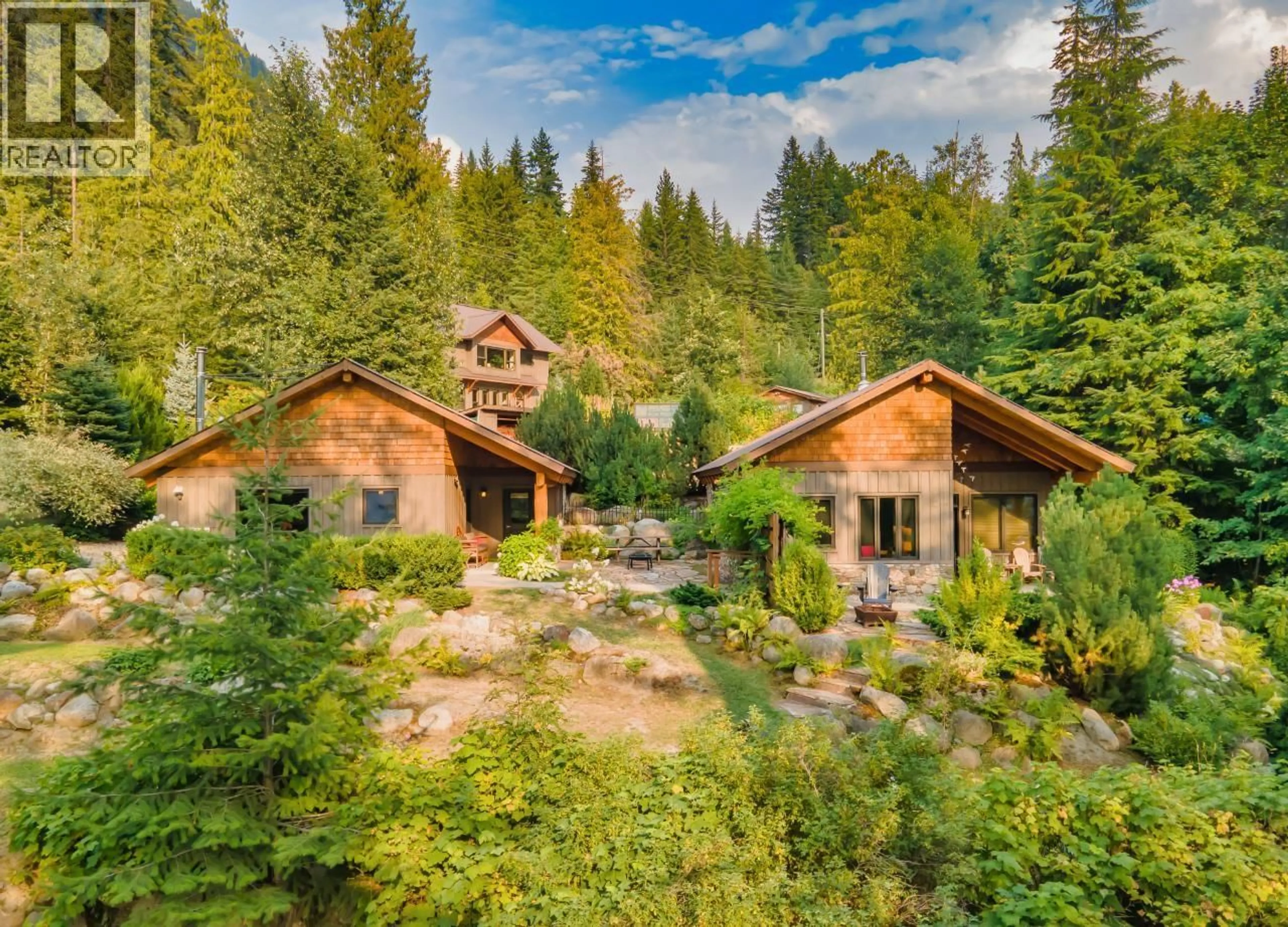 A pic from outside/outdoor area/front of a property/back of a property/a pic from drone, forest/trees view for 6575 6 HIGHWAY, New Denver British Columbia V0G1S0