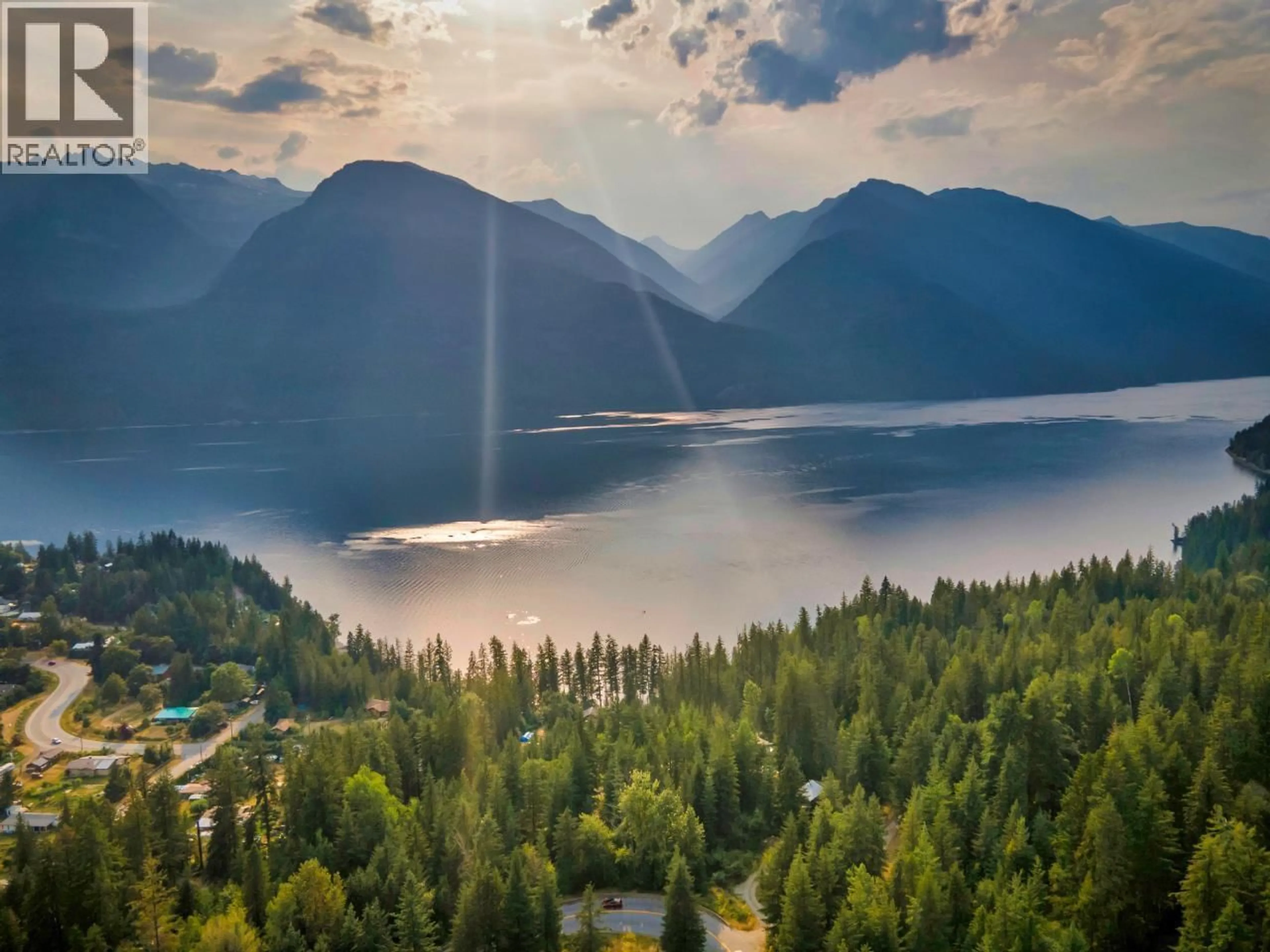 A pic from outside/outdoor area/front of a property/back of a property/a pic from drone, water/lake/river/ocean view for 6575 6 HIGHWAY, New Denver British Columbia V0G1S0