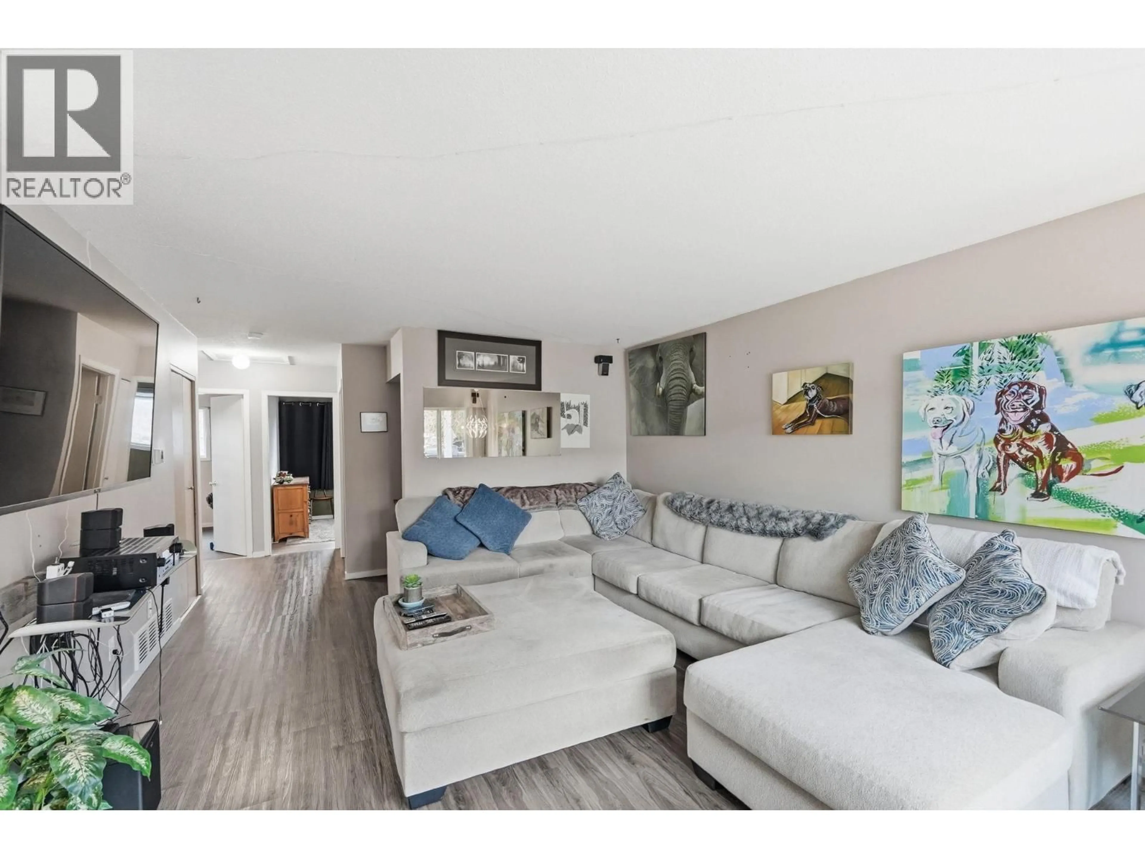 Living room with furniture, wood/laminate floor for 375 NORTON STREET, Penticton British Columbia V2A4H9