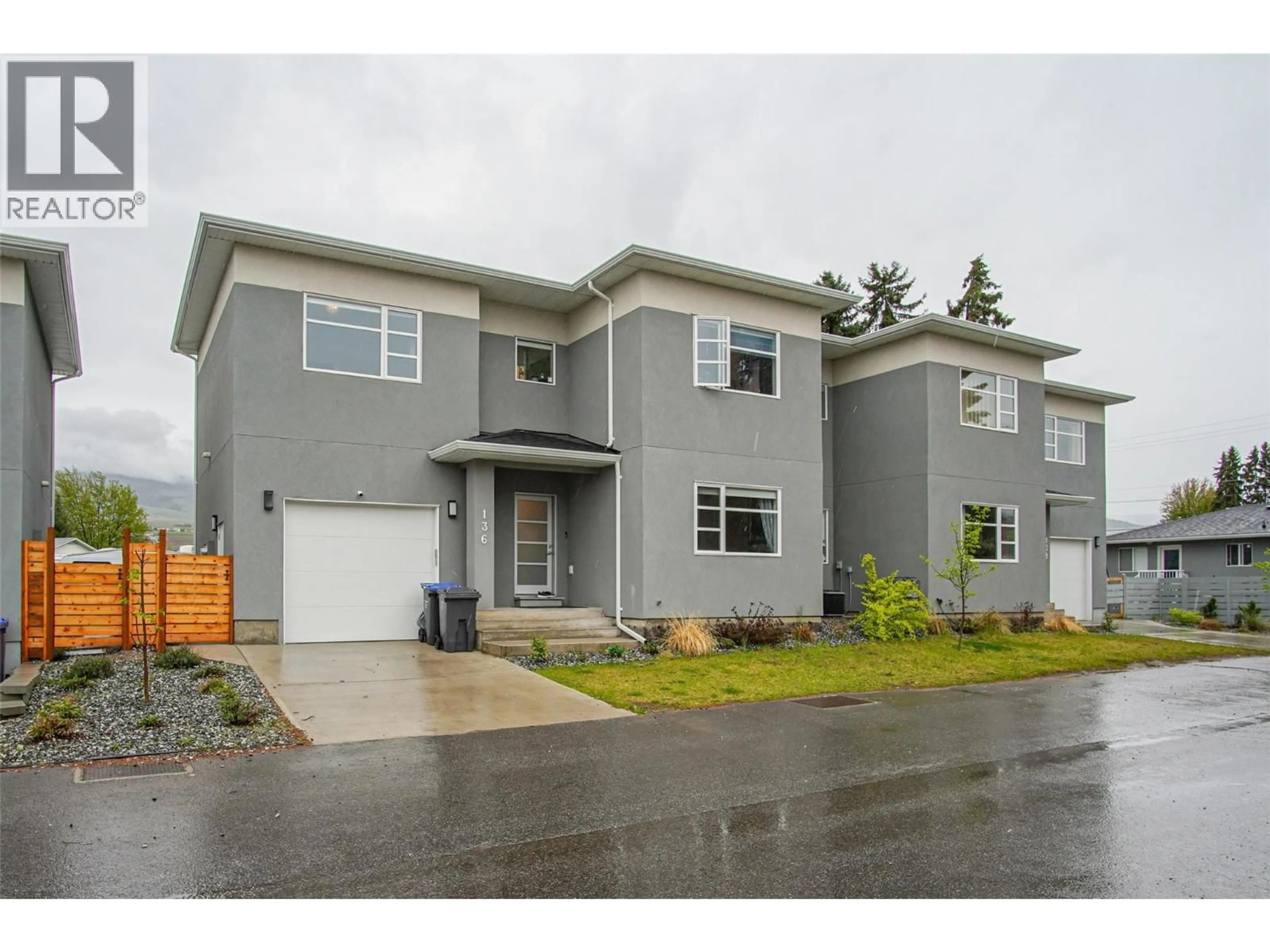 Home with vinyl exterior material, street for 136 MUGFORD ROAD, Kelowna British Columbia V1X3B3