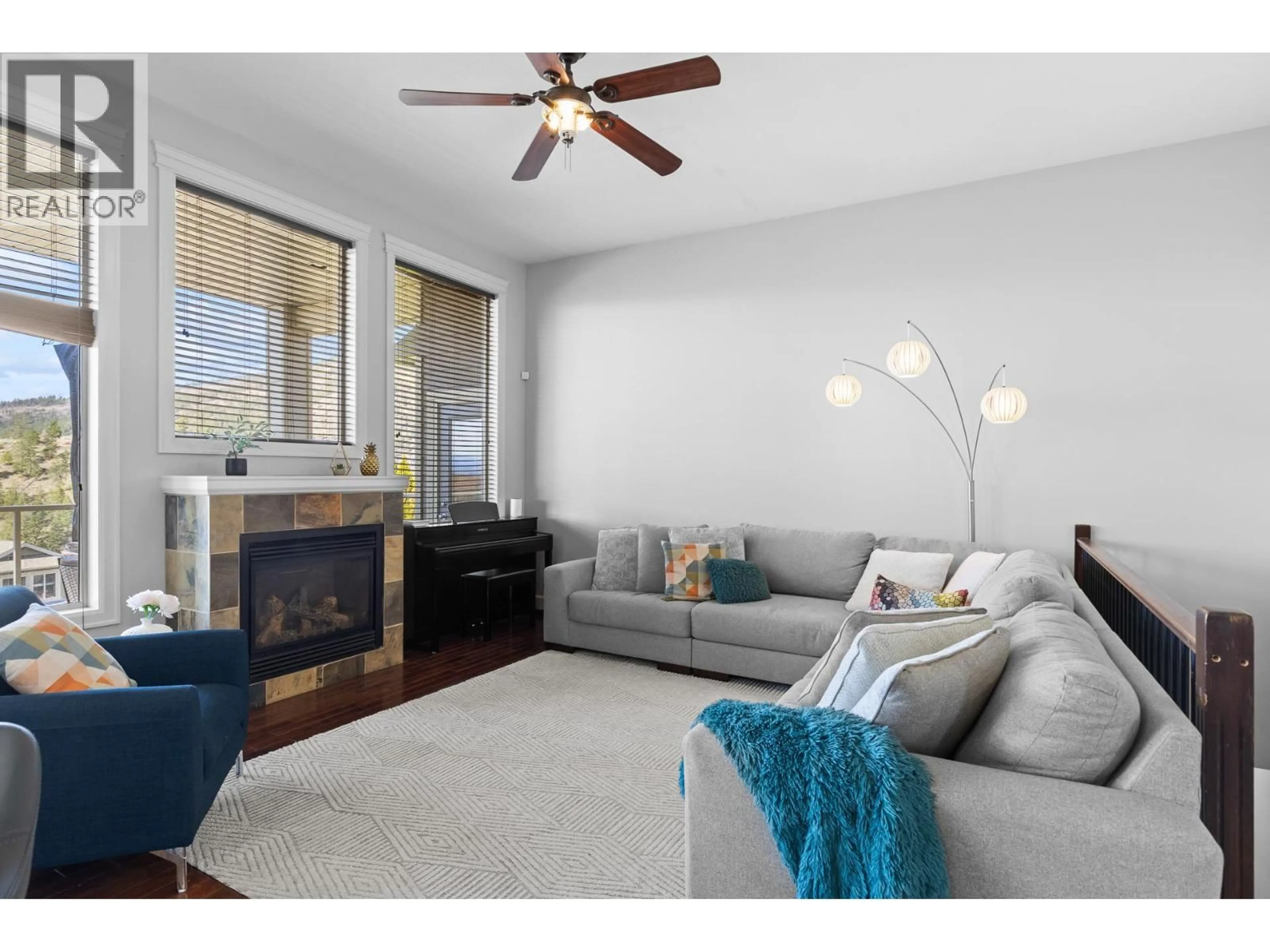 Living room with furniture, wood/laminate floor for 2038 CORNERSTONE DRIVE, West Kelowna British Columbia V4T2Y3