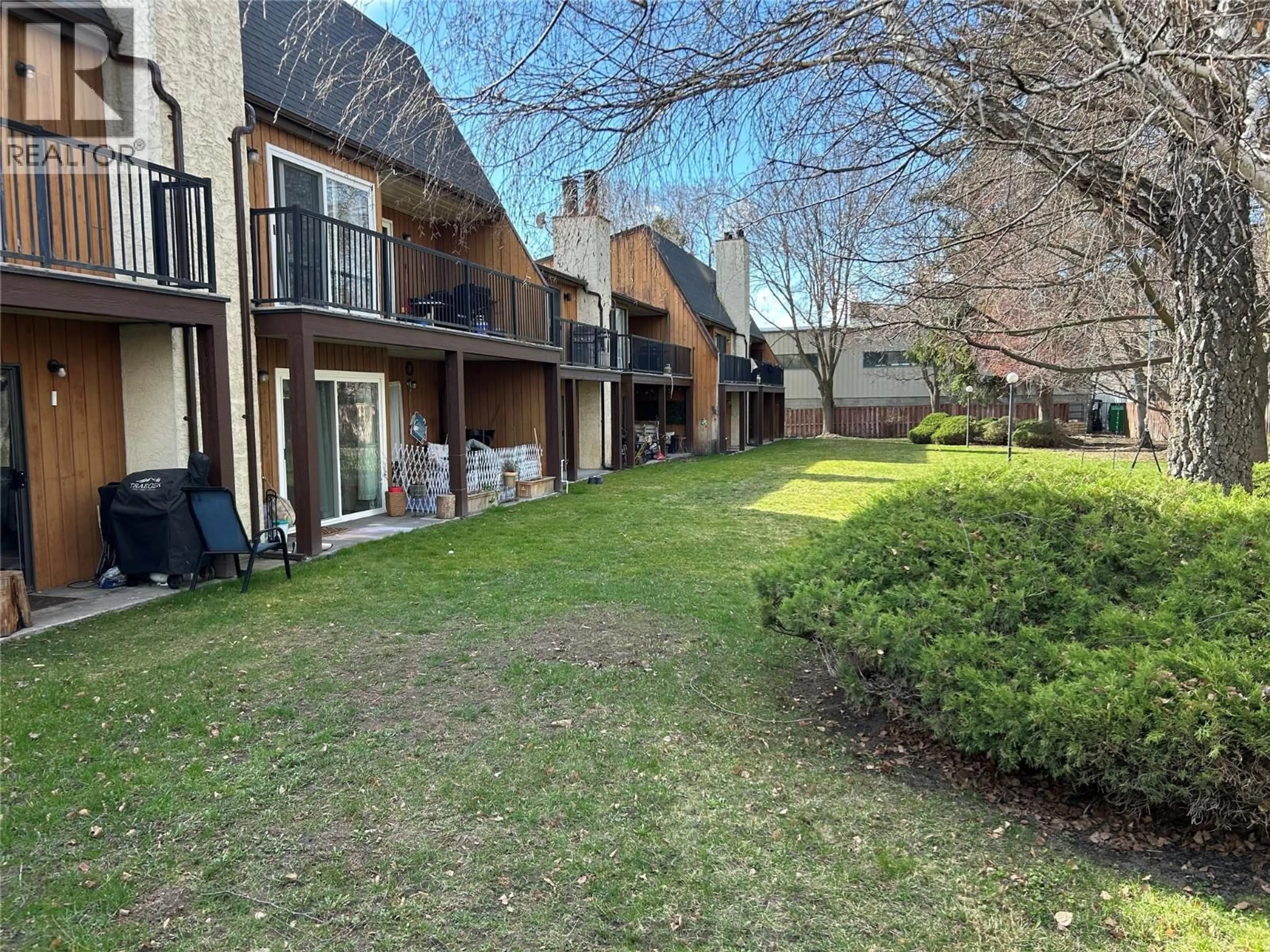 A pic from outside/outdoor area/front of a property/back of a property/a pic from drone, street for 107 - 290 MILLS ROAD, Kelowna British Columbia V1X4G8