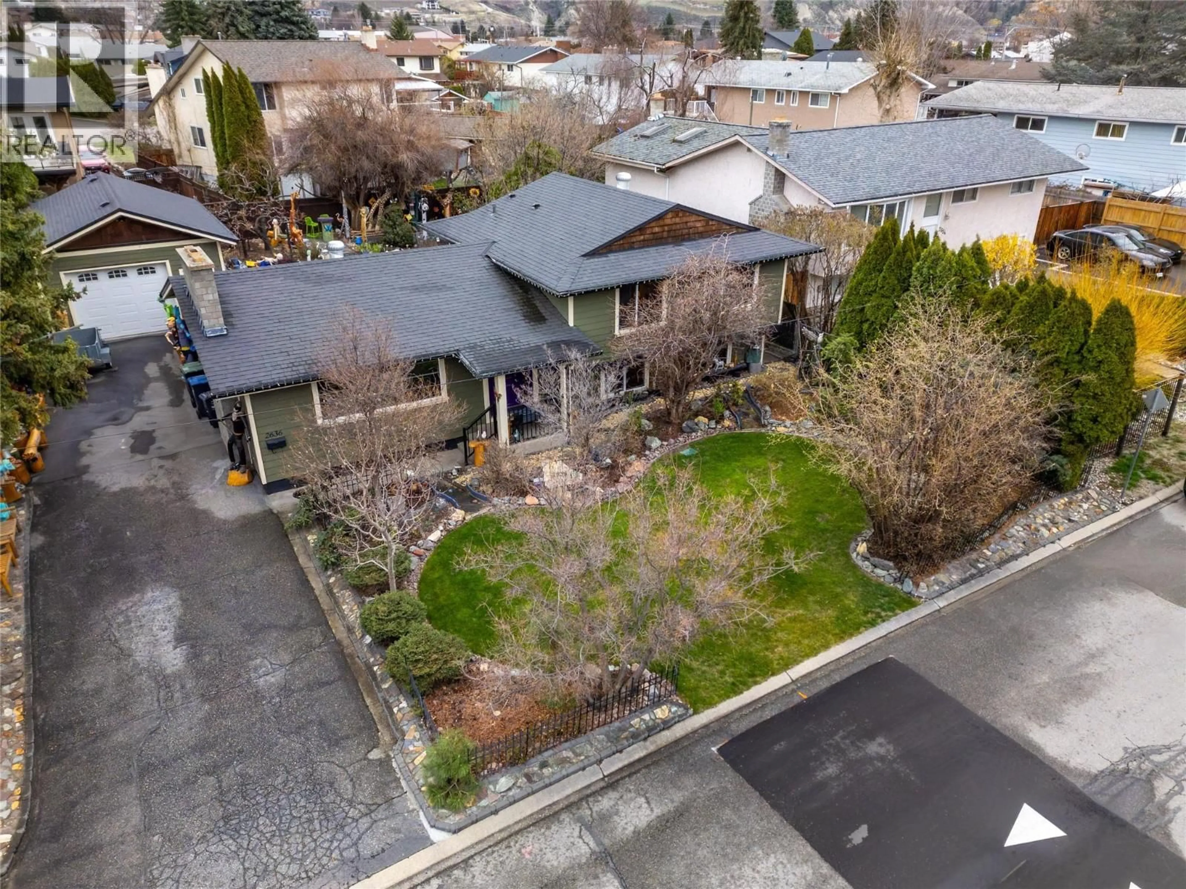 A pic from outside/outdoor area/front of a property/back of a property/a pic from drone, street for 2636 CORNWALL DRIVE, Penticton British Columbia V2A6X3