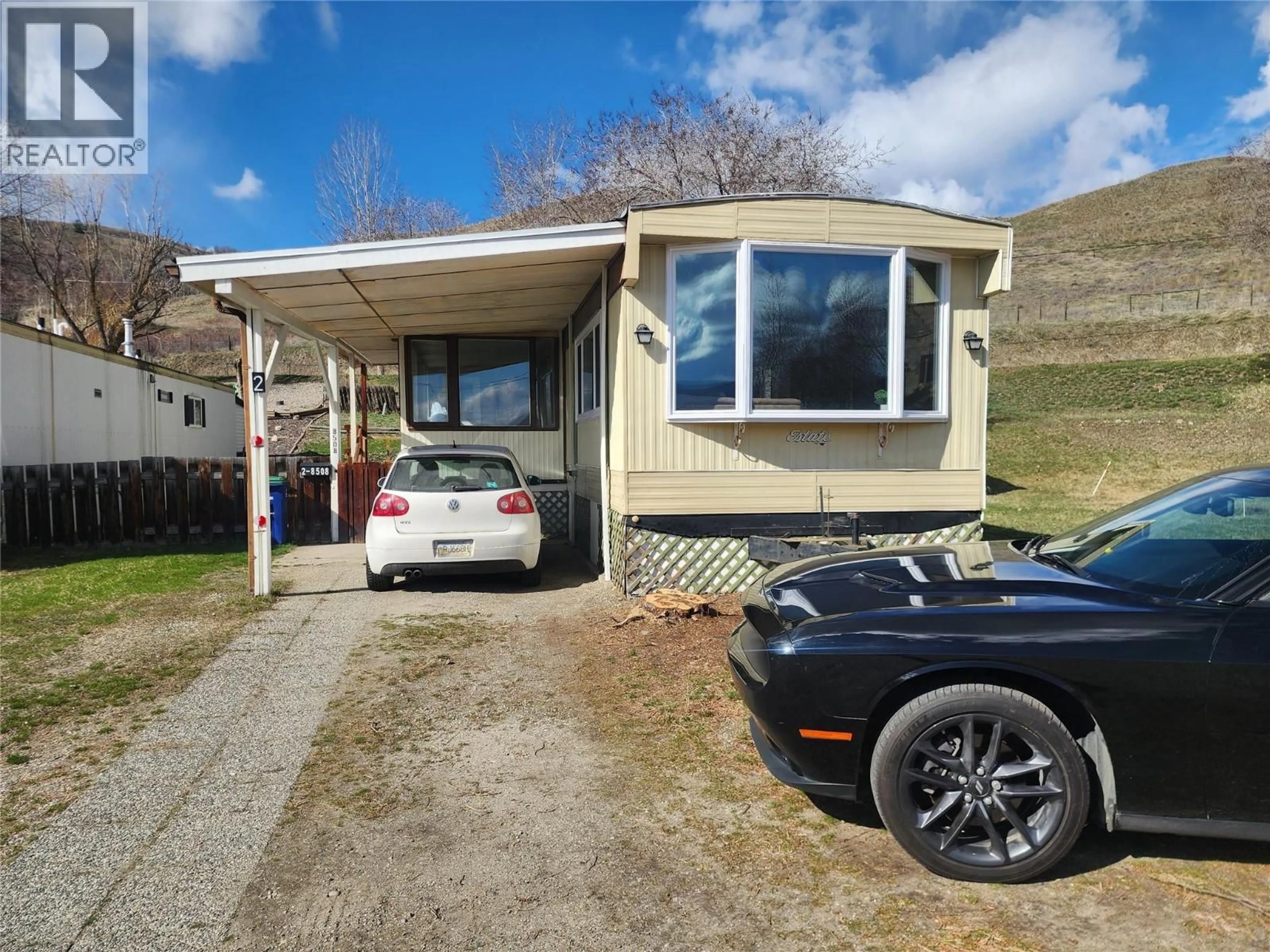 A pic from outside/outdoor area/front of a property/back of a property/a pic from drone, street for 2 - 8508 CLERKE ROAD, Coldstream British Columbia V1B1W2