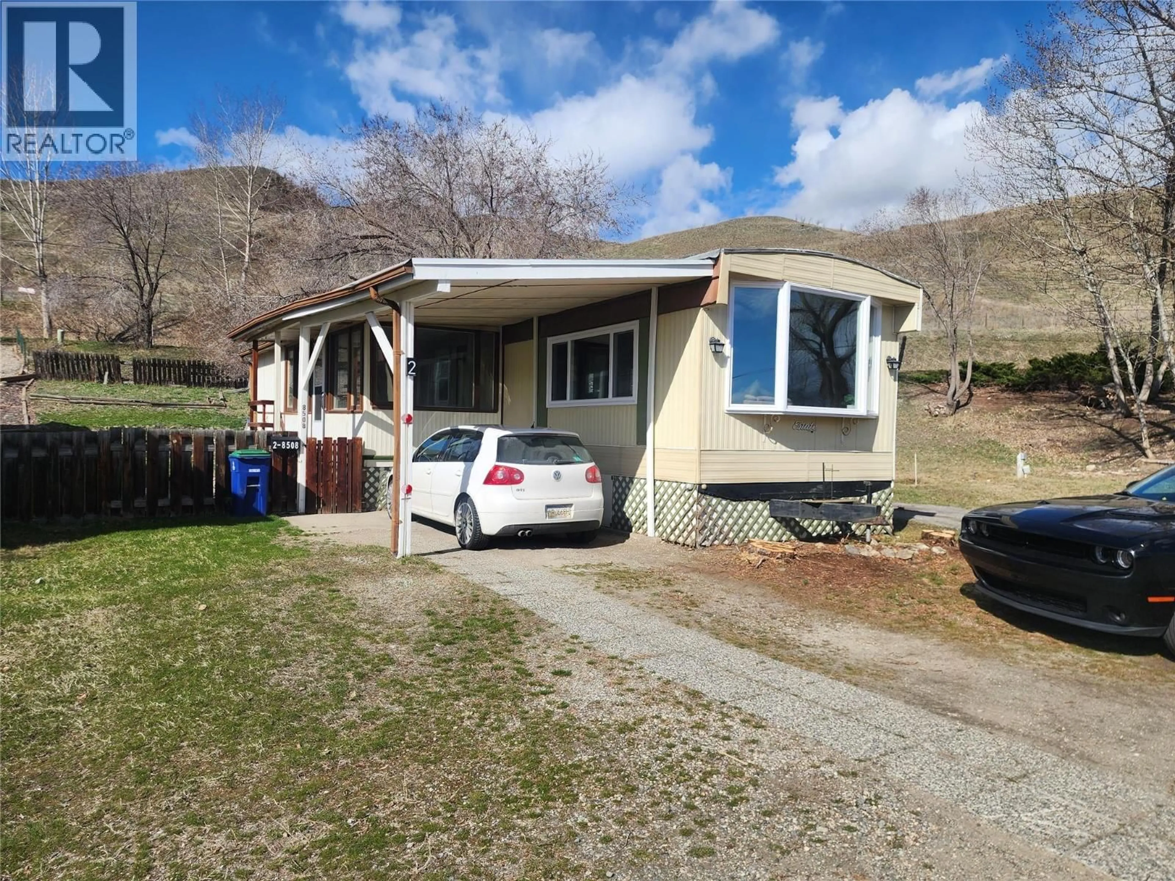 Home with vinyl exterior material, street for 2 - 8508 CLERKE ROAD, Coldstream British Columbia V1B1W2