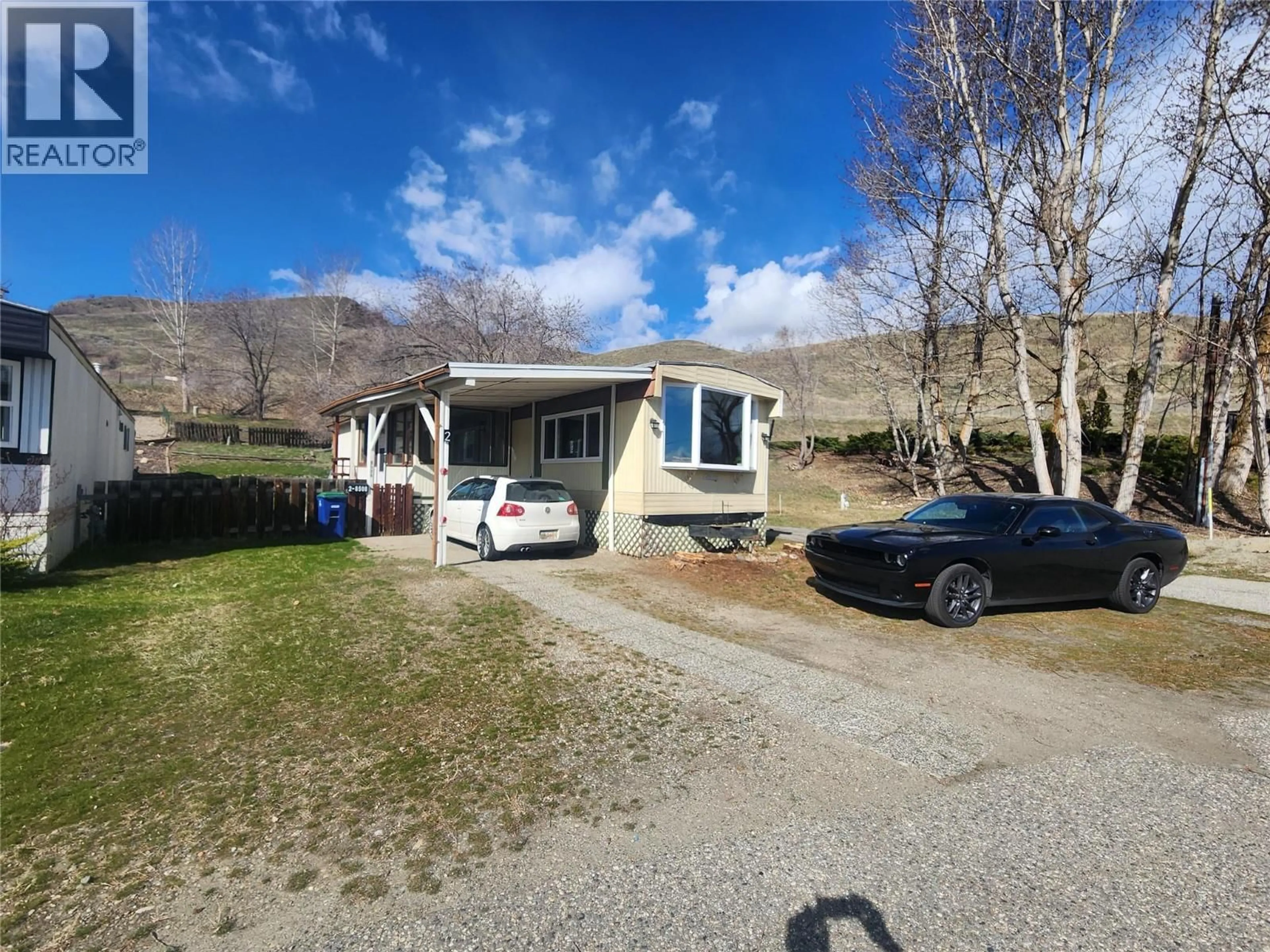A pic from outside/outdoor area/front of a property/back of a property/a pic from drone, street for 2 - 8508 CLERKE ROAD, Coldstream British Columbia V1B1W2
