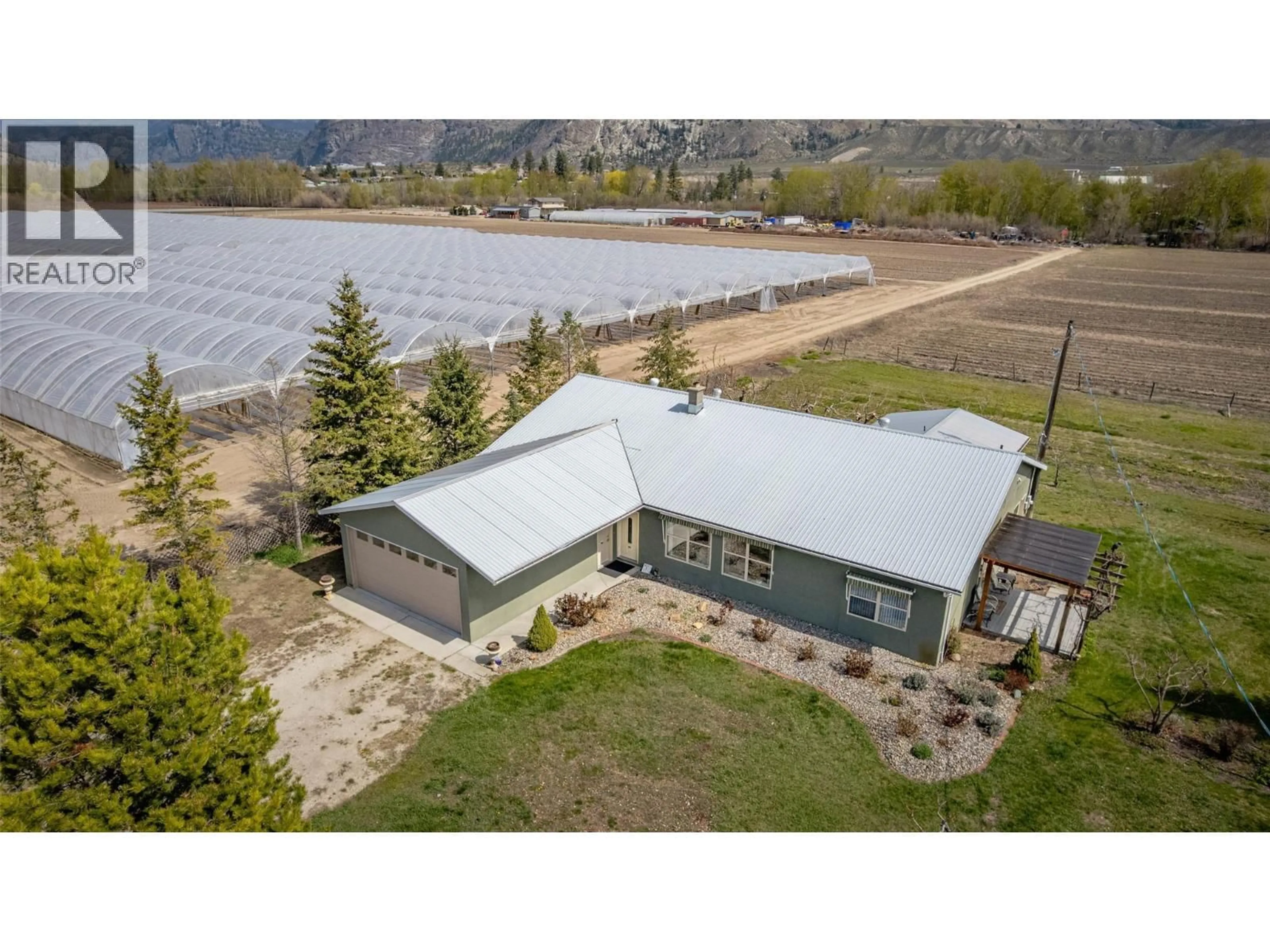 A pic from outside/outdoor area/front of a property/back of a property/a pic from drone, water/lake/river/ocean view for 7231 ISLAND ROAD, Oliver British Columbia V0H1T7