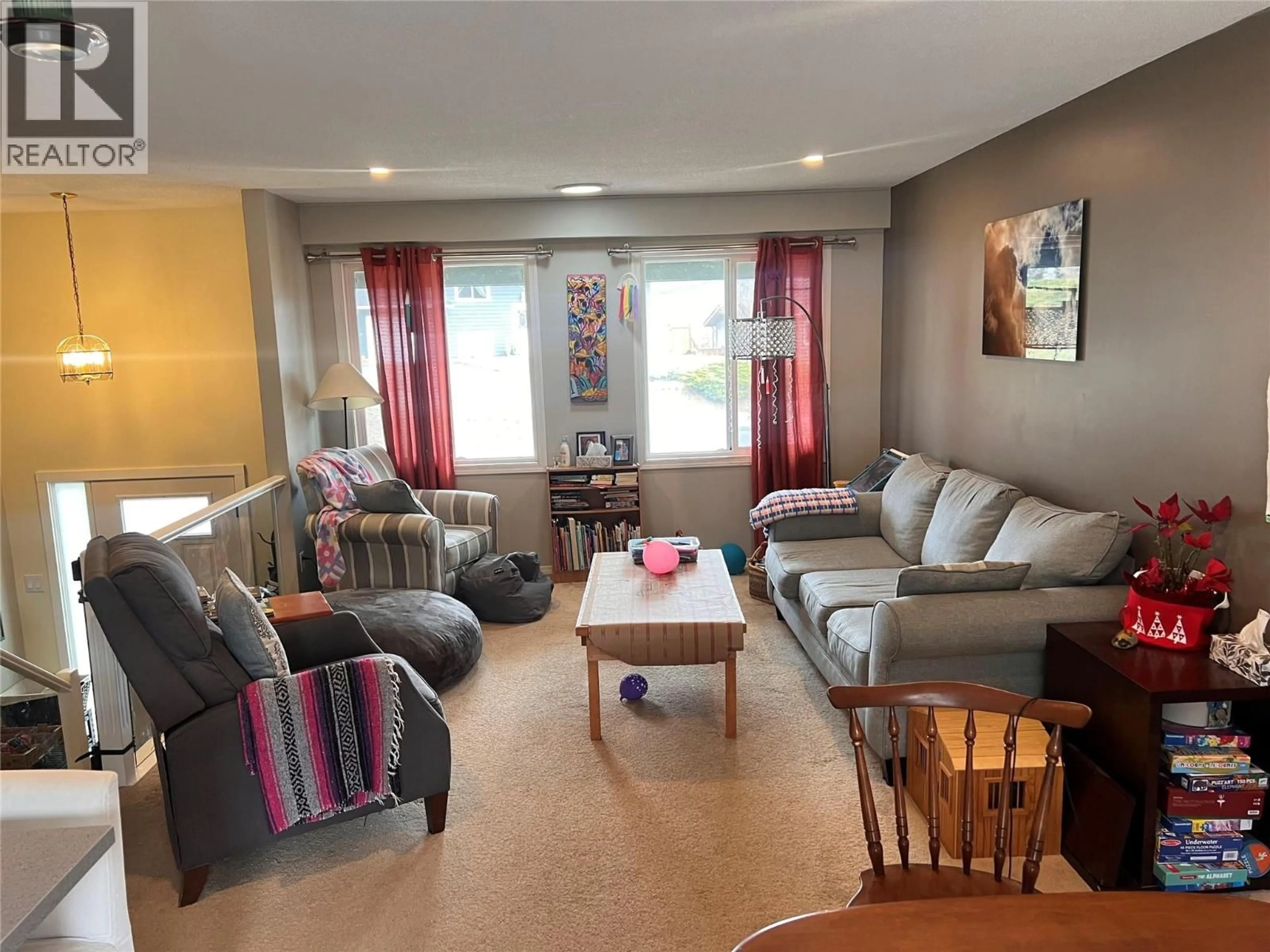 Living room with furniture, wood/laminate floor for 1290 HIGHRIDGE DRIVE, Kamloops British Columbia V2C5G6