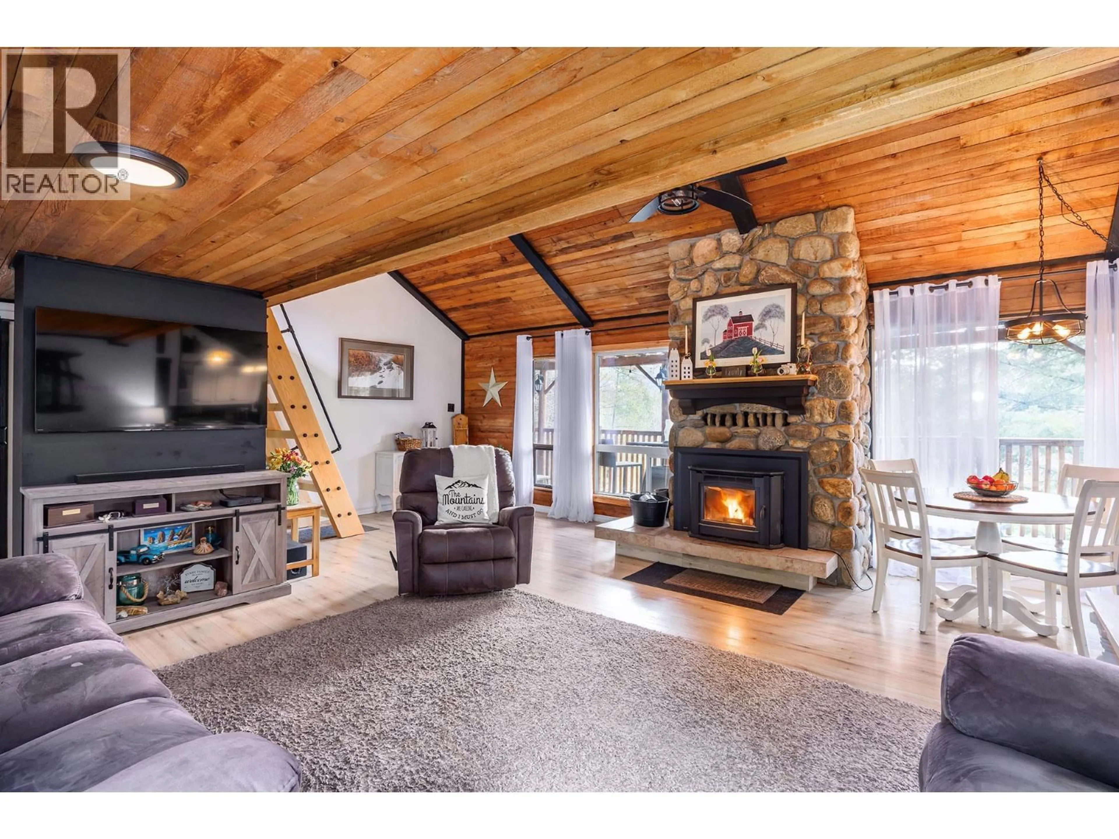 Living room with furniture, unknown for 11251 THREE FORKS ROAD, Kelowna British Columbia V1P1J8