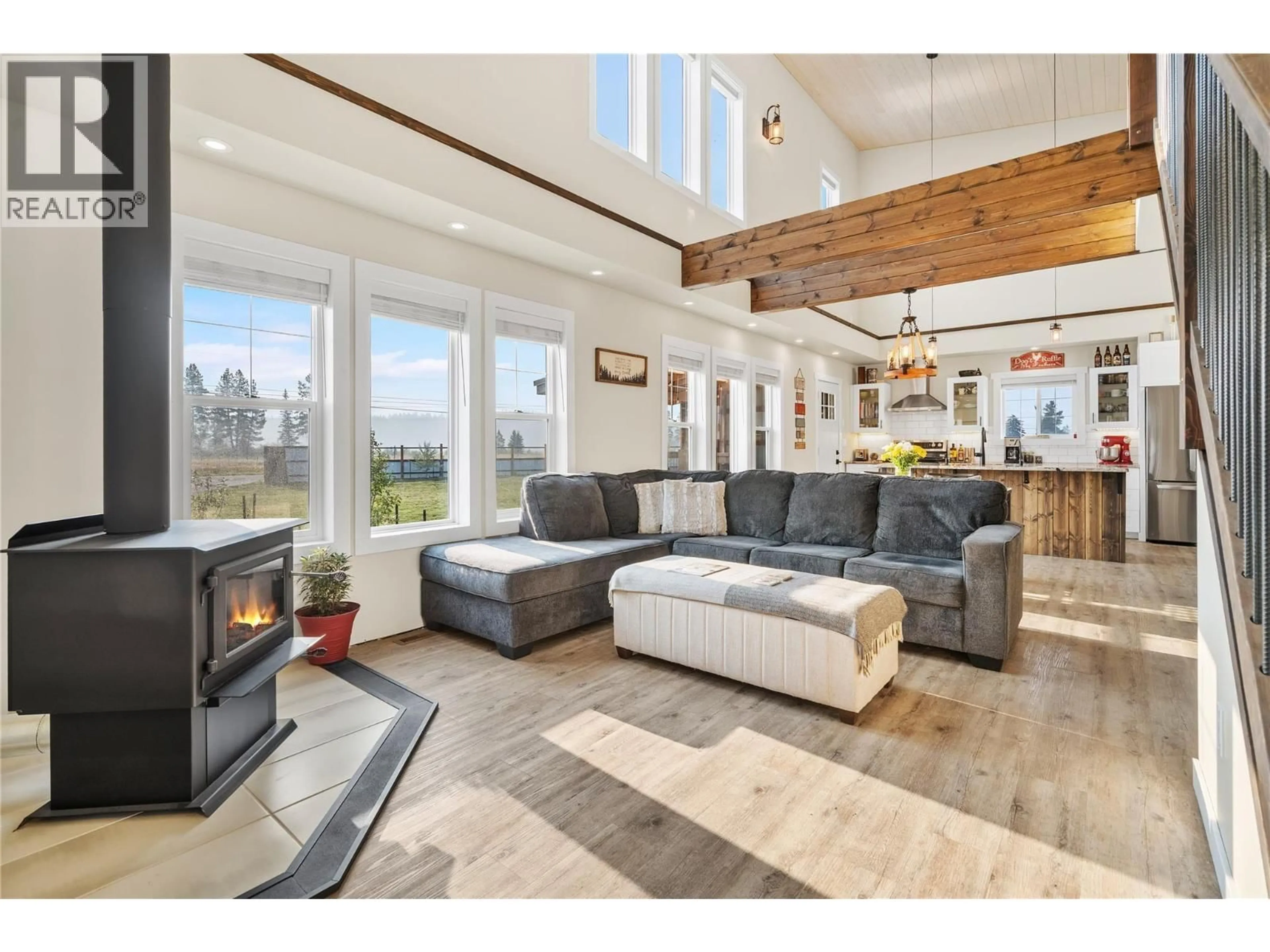 Living room with furniture, wood/laminate floor for 5469 RIVERVIEW FRONTAGE ROAD, Ta Ta Creek British Columbia V0B2H0