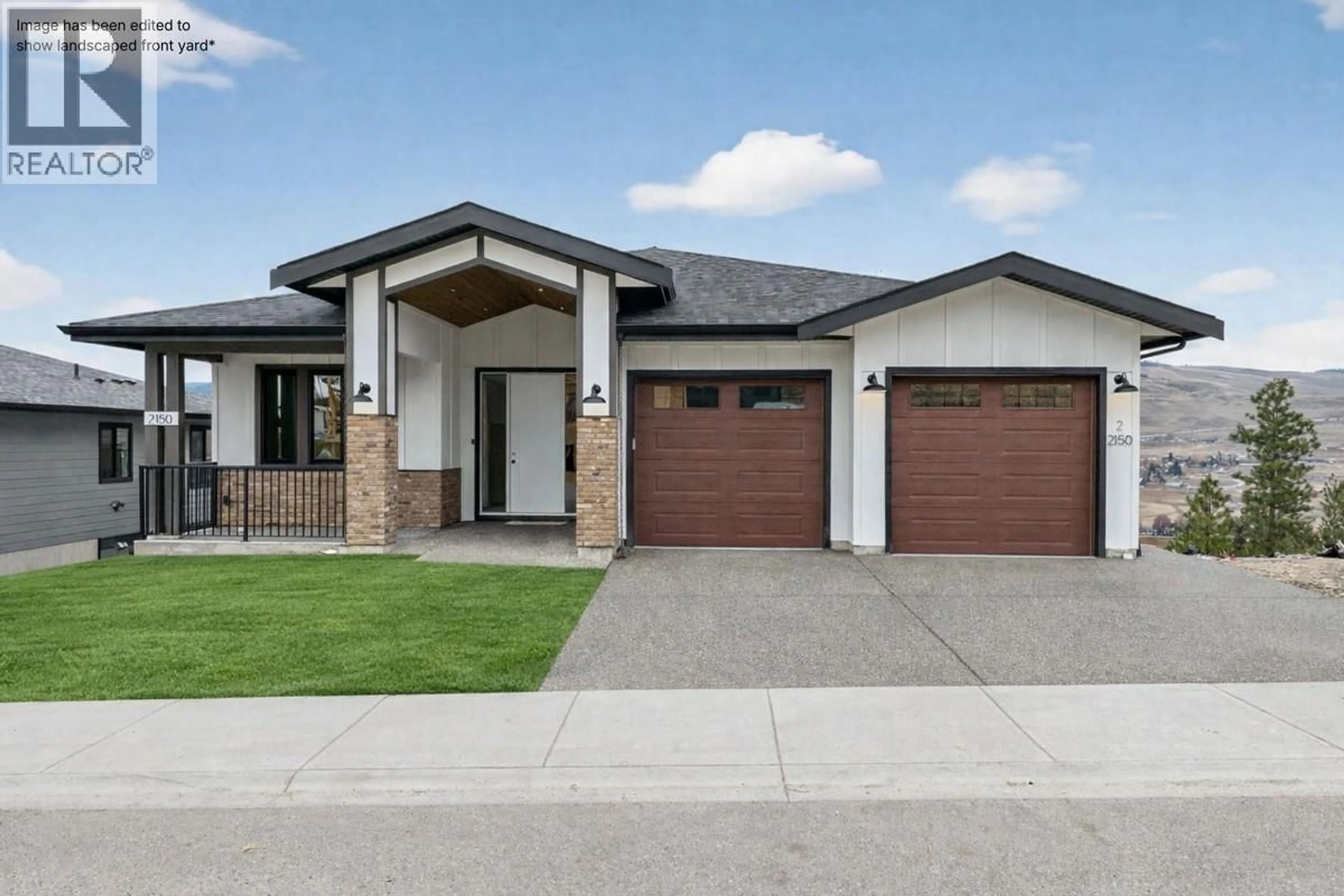 Home with brick exterior material, street for 2150 MONTENEGRO DRIVE, Kelowna British Columbia V1P0B2