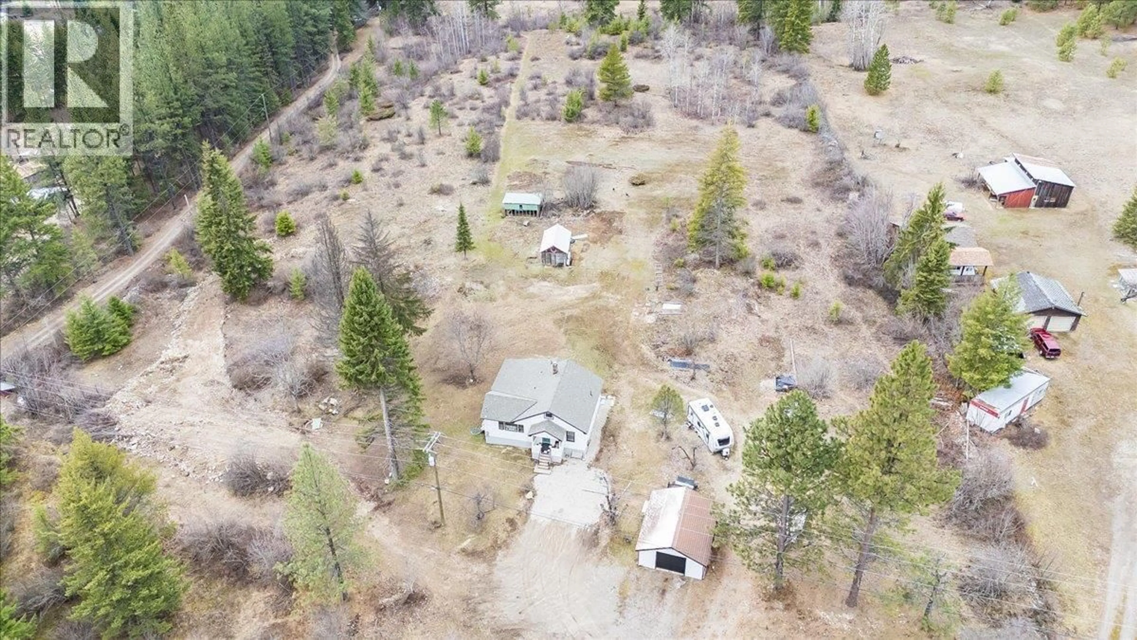 A pic from outside/outdoor area/front of a property/back of a property/a pic from drone, forest/trees view for 6024 HUTCHINS ROAD, Taghum British Columbia V1L6Y1