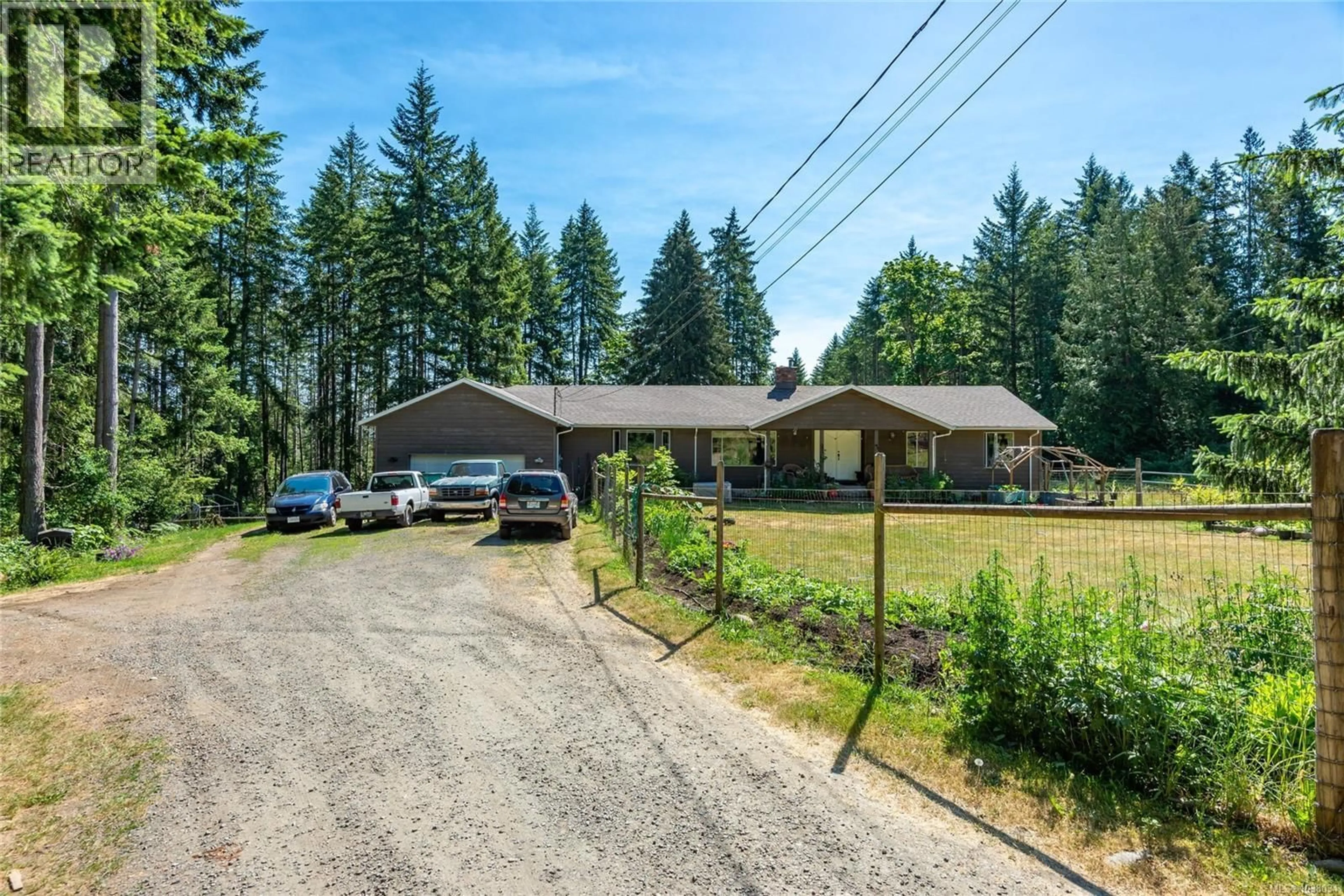 A pic from outside/outdoor area/front of a property/back of a property/a pic from drone, unknown for 8598 ISLAND HIGHWAY NORTH, Black Creek British Columbia V9N1H3
