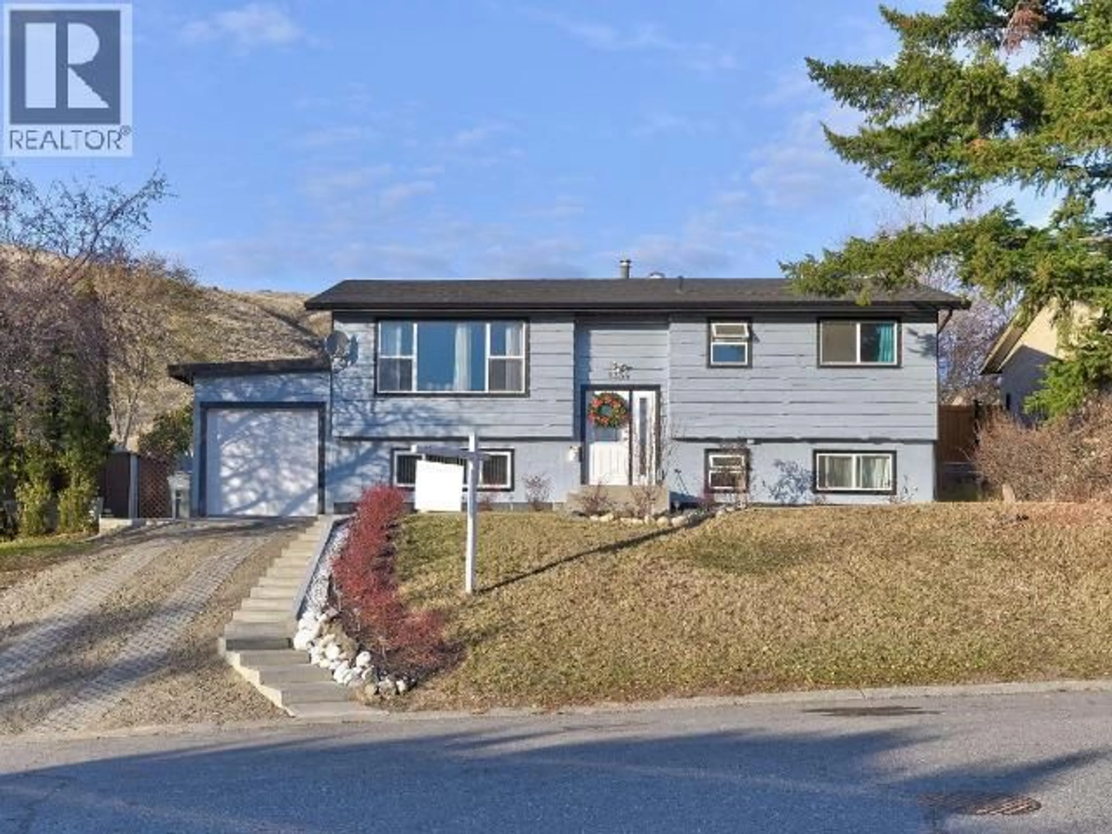 Home with vinyl exterior material, street for 1334 HOOK DRIVE, Kamloops British Columbia V2B7S9