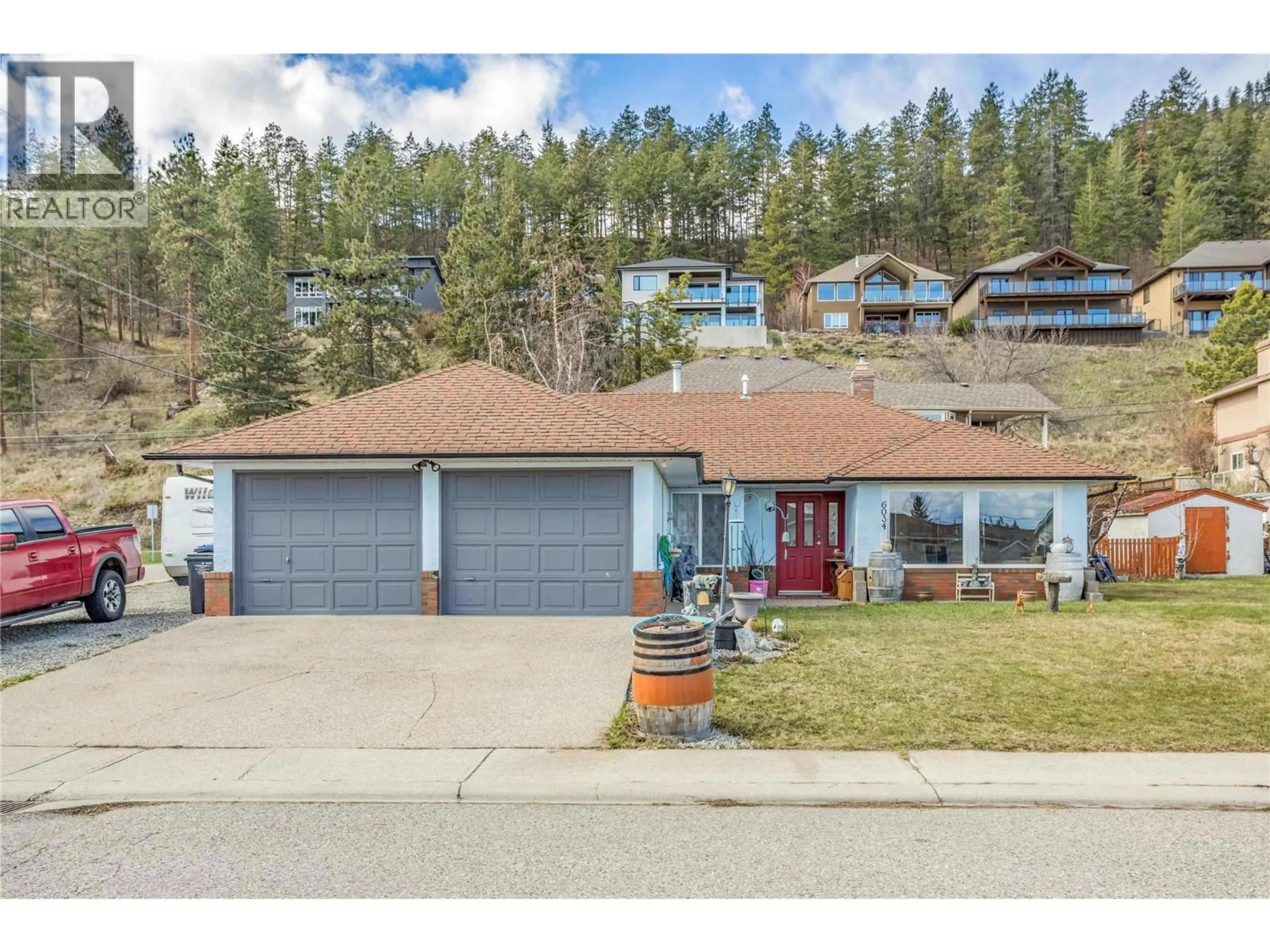 A pic from outside/outdoor area/front of a property/back of a property/a pic from drone, street for 6034 GARRAWAY PLACE, Peachland British Columbia V0H1X4