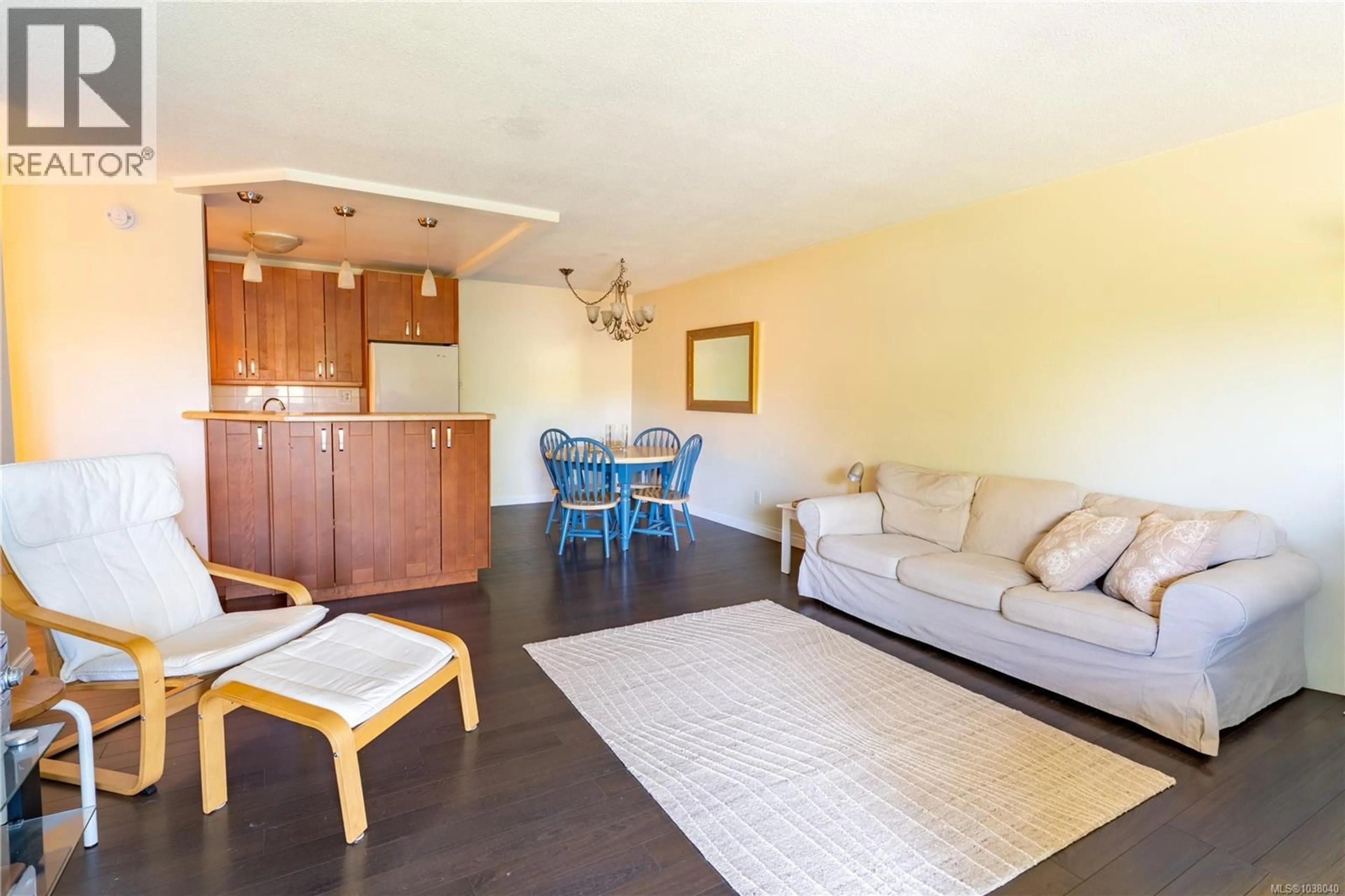 Living room with furniture, wood/laminate floor for 220 - 1870 MCKENZIE AVENUE, Saanich British Columbia V8N4X3