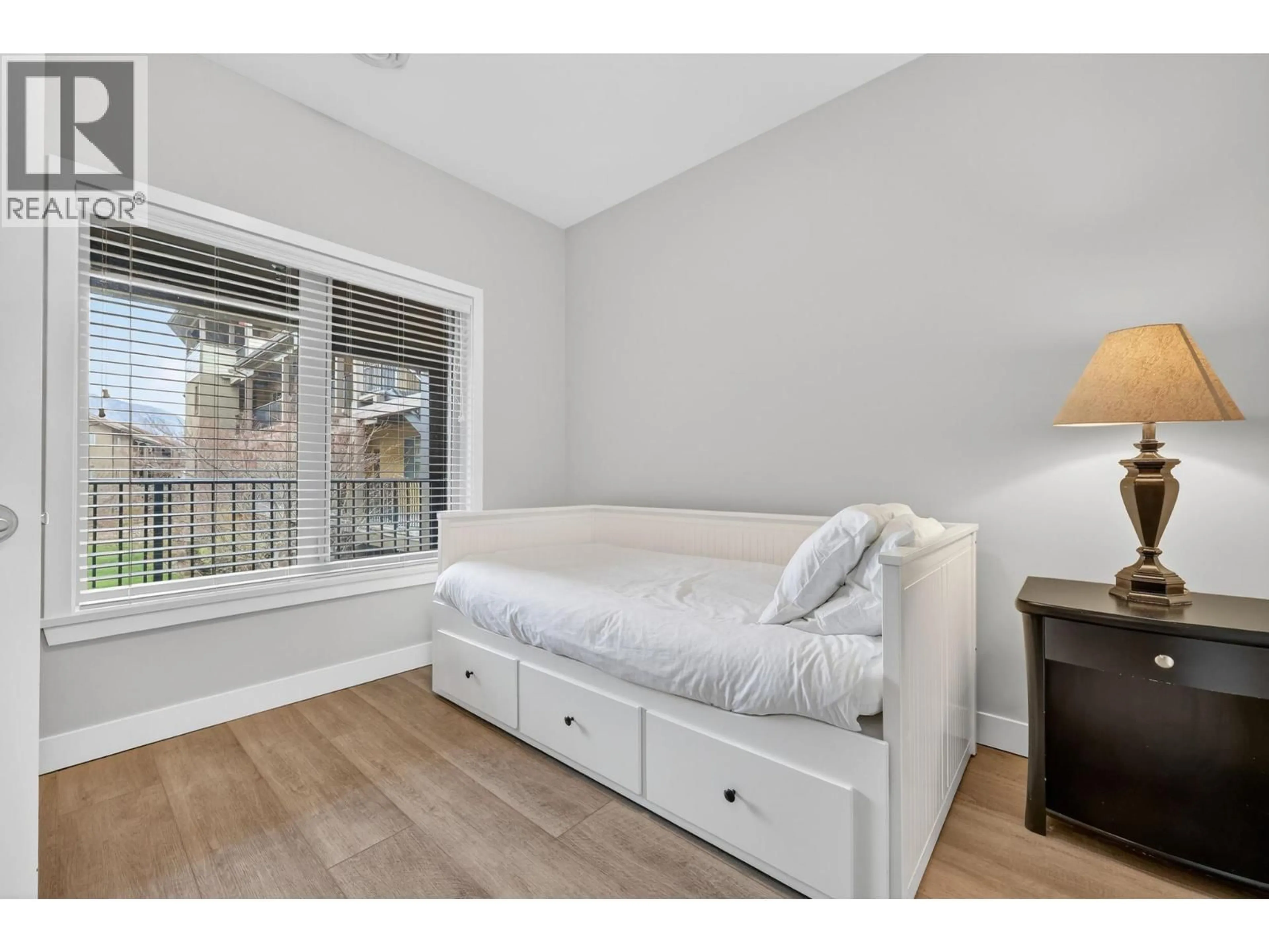 Bedroom with bed, wood/laminate floor for 1306 - 4016 PRITCHARD DRIVE, West Kelowna British Columbia V4T3E4