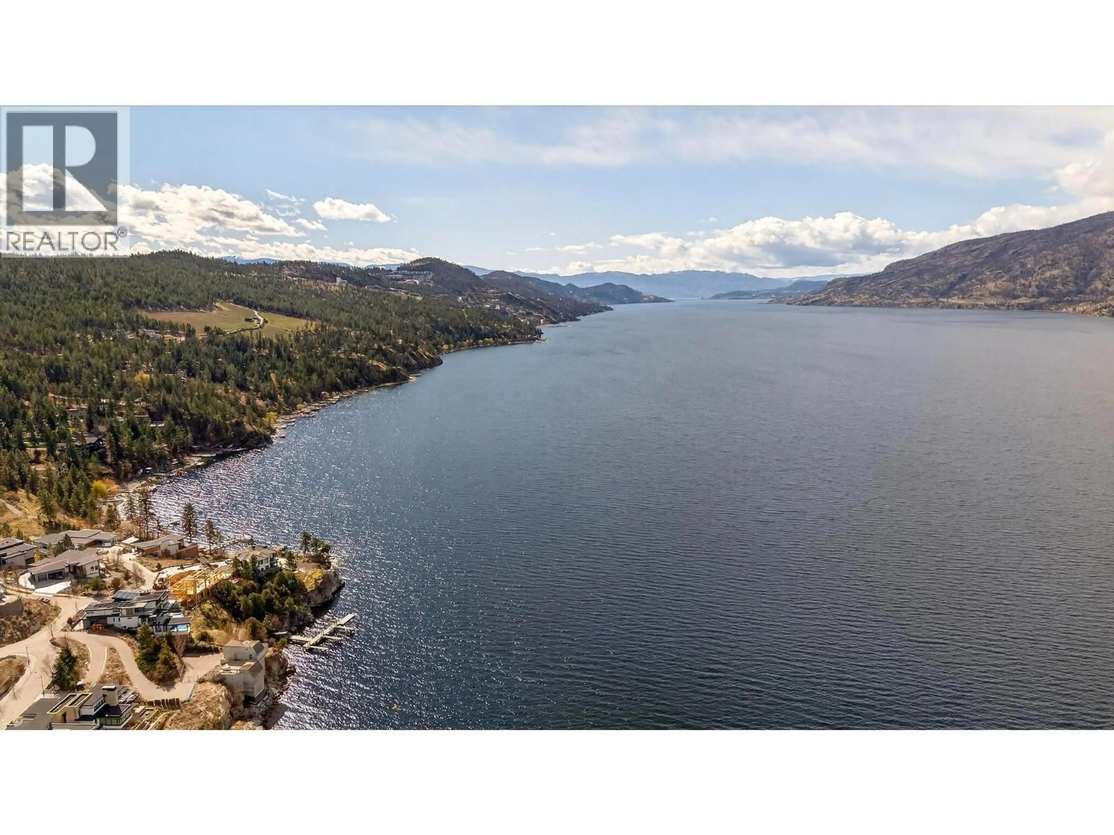 A pic from outside/outdoor area/front of a property/back of a property/a pic from drone, water/lake/river/ocean view for 2 - 9201 OKANAGAN CENTRE ROAD WEST, Lake Country British Columbia V4V0B8