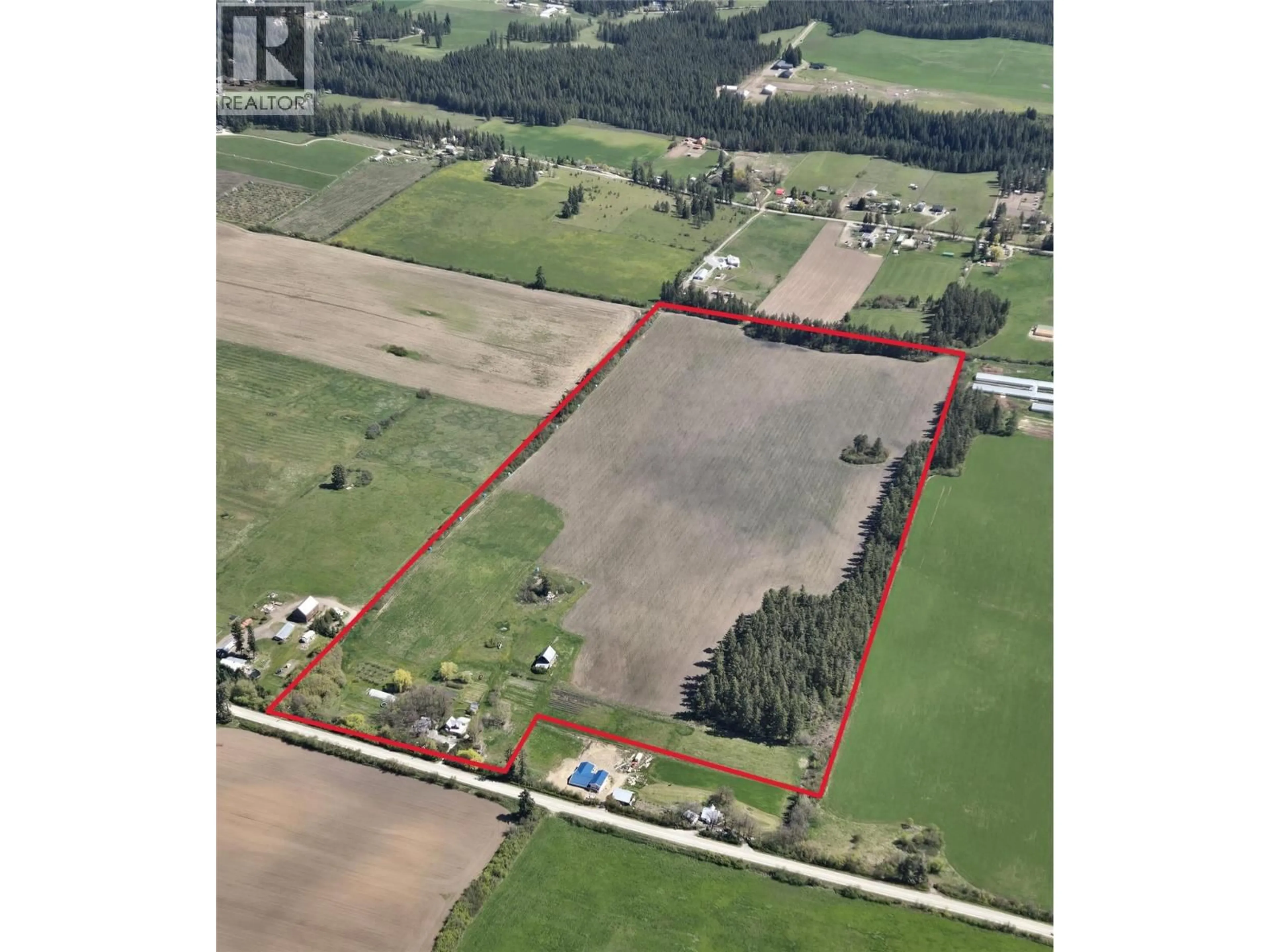 A pic from outside/outdoor area/front of a property/back of a property/a pic from drone, building for 4462 SALMON RIVER ROAD, Spallumcheen British Columbia V4Y0W7