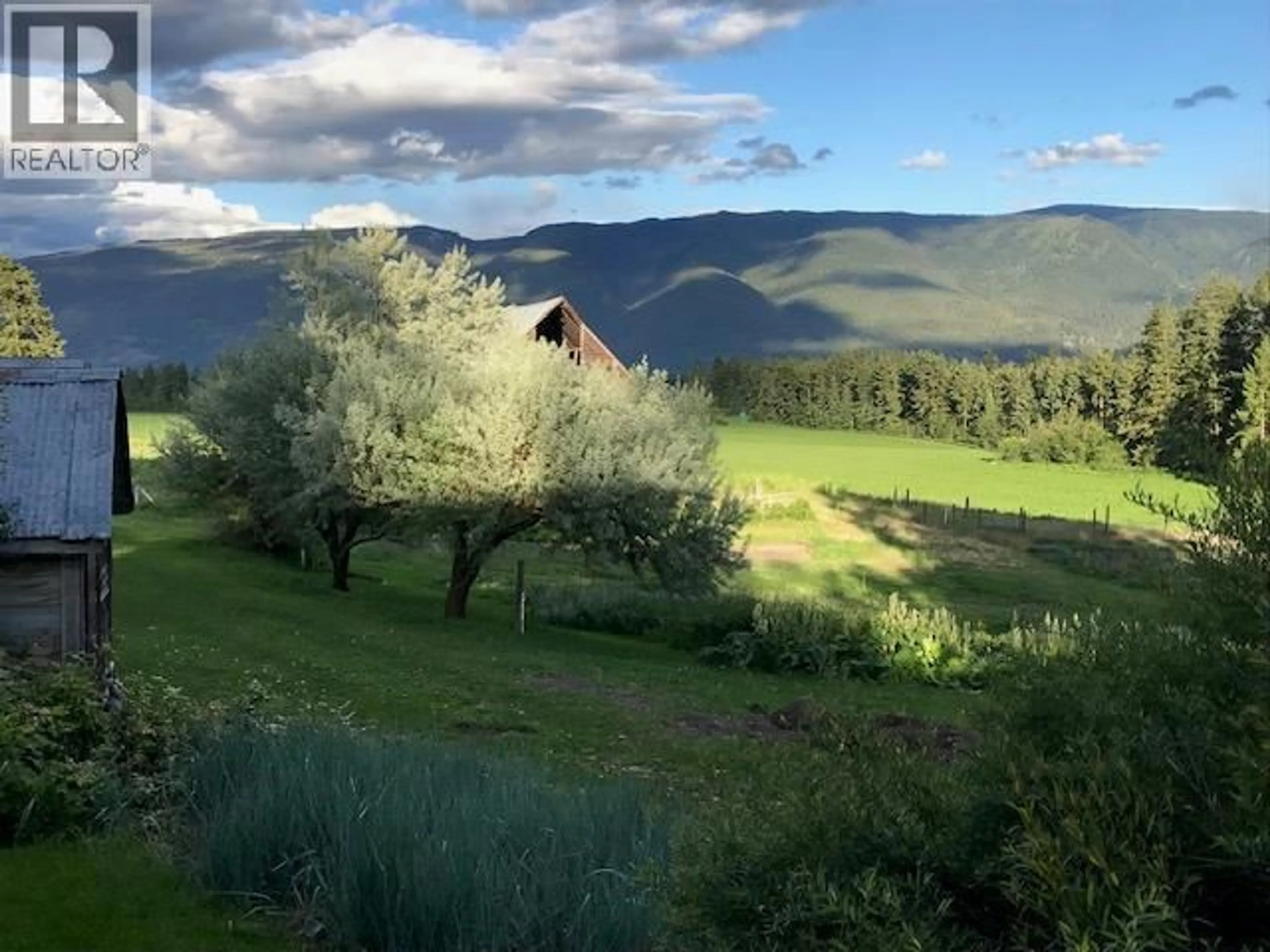 A pic from outside/outdoor area/front of a property/back of a property/a pic from drone, mountain view for 4462 SALMON RIVER ROAD, Spallumcheen British Columbia V4Y0W7