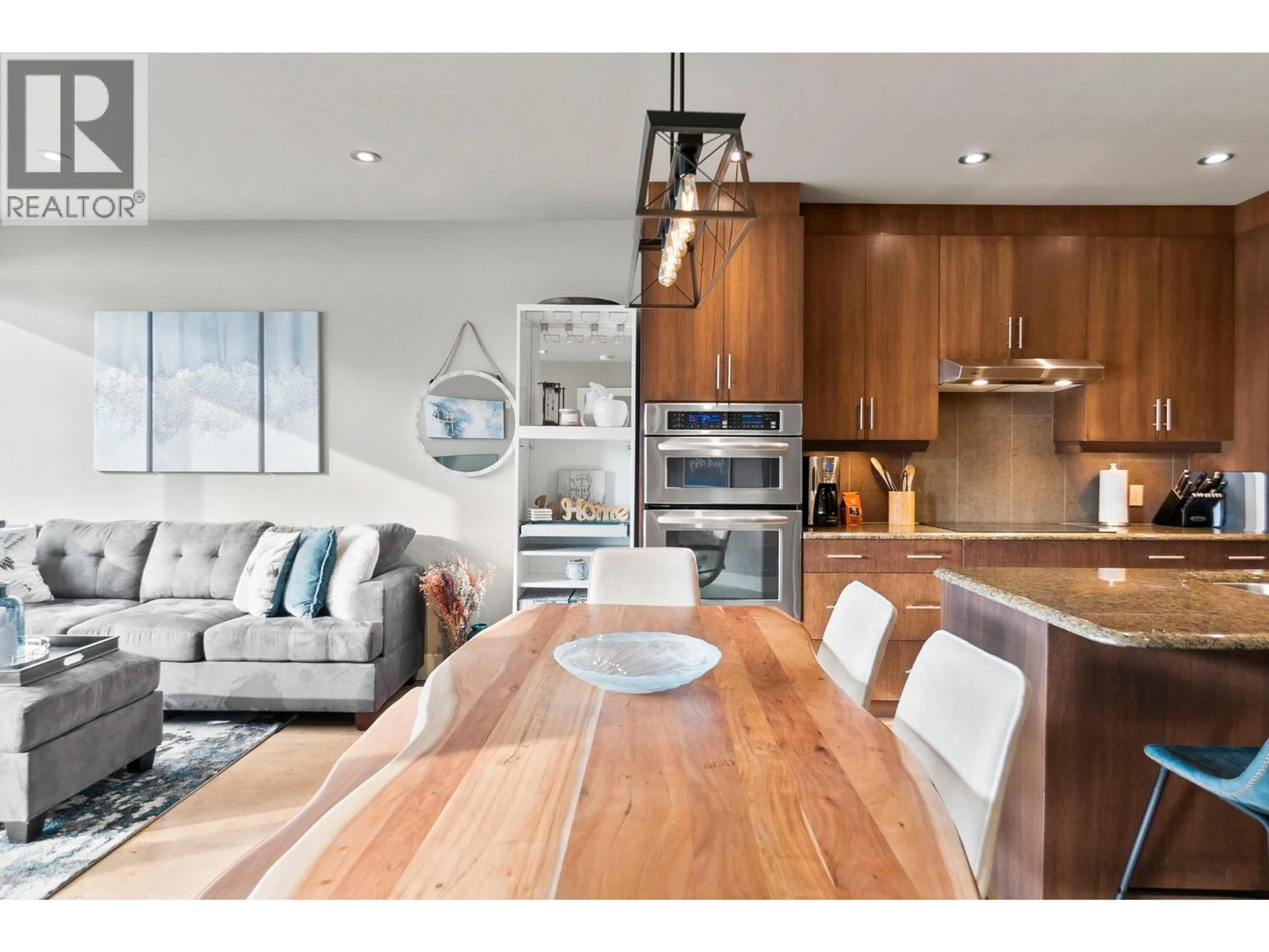 Open concept kitchen, wood/laminate floor for 105 - 326 MARA LAKE LANE, Sicamous British Columbia V0E2V1