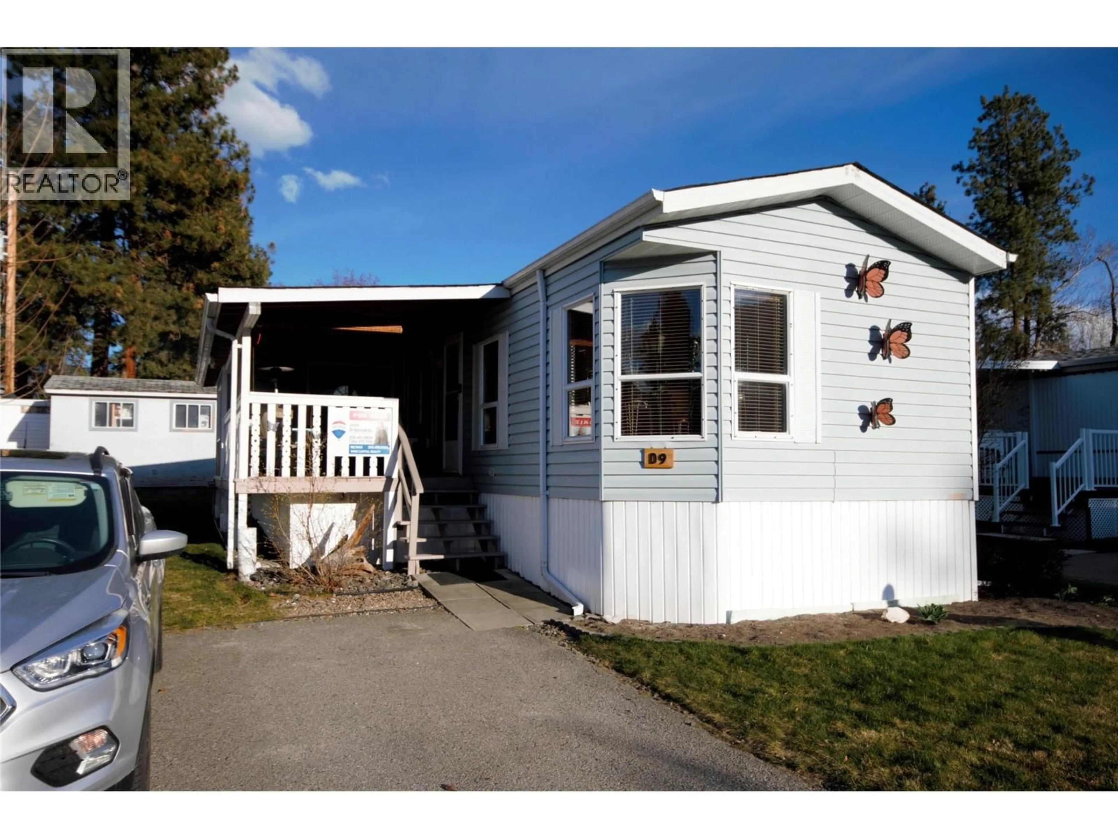 Home with vinyl exterior material, street for D9 - 4505 MCLEAN CREEK ROAD, Okanagan Falls British Columbia V0H1R1