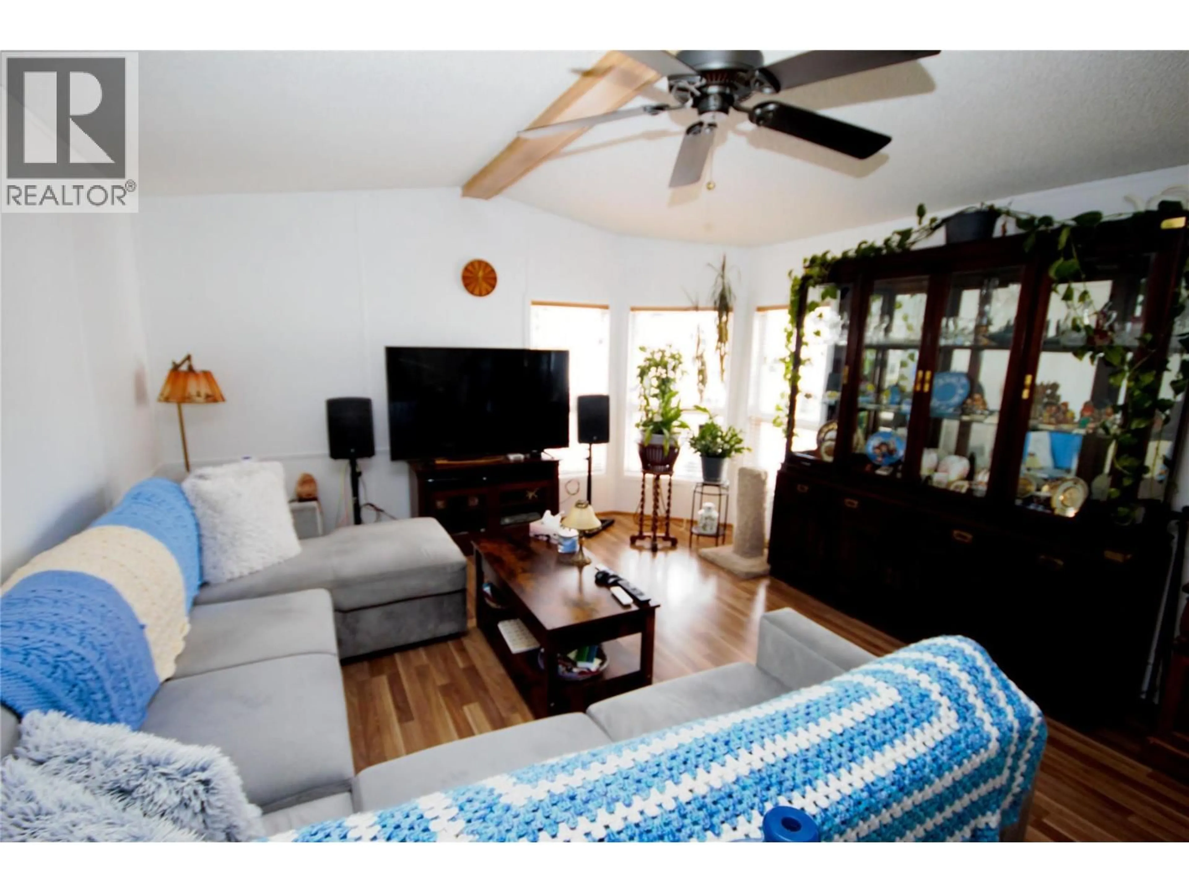 Living room with furniture, wood/laminate floor for D9 - 4505 MCLEAN CREEK ROAD, Okanagan Falls British Columbia V0H1R1