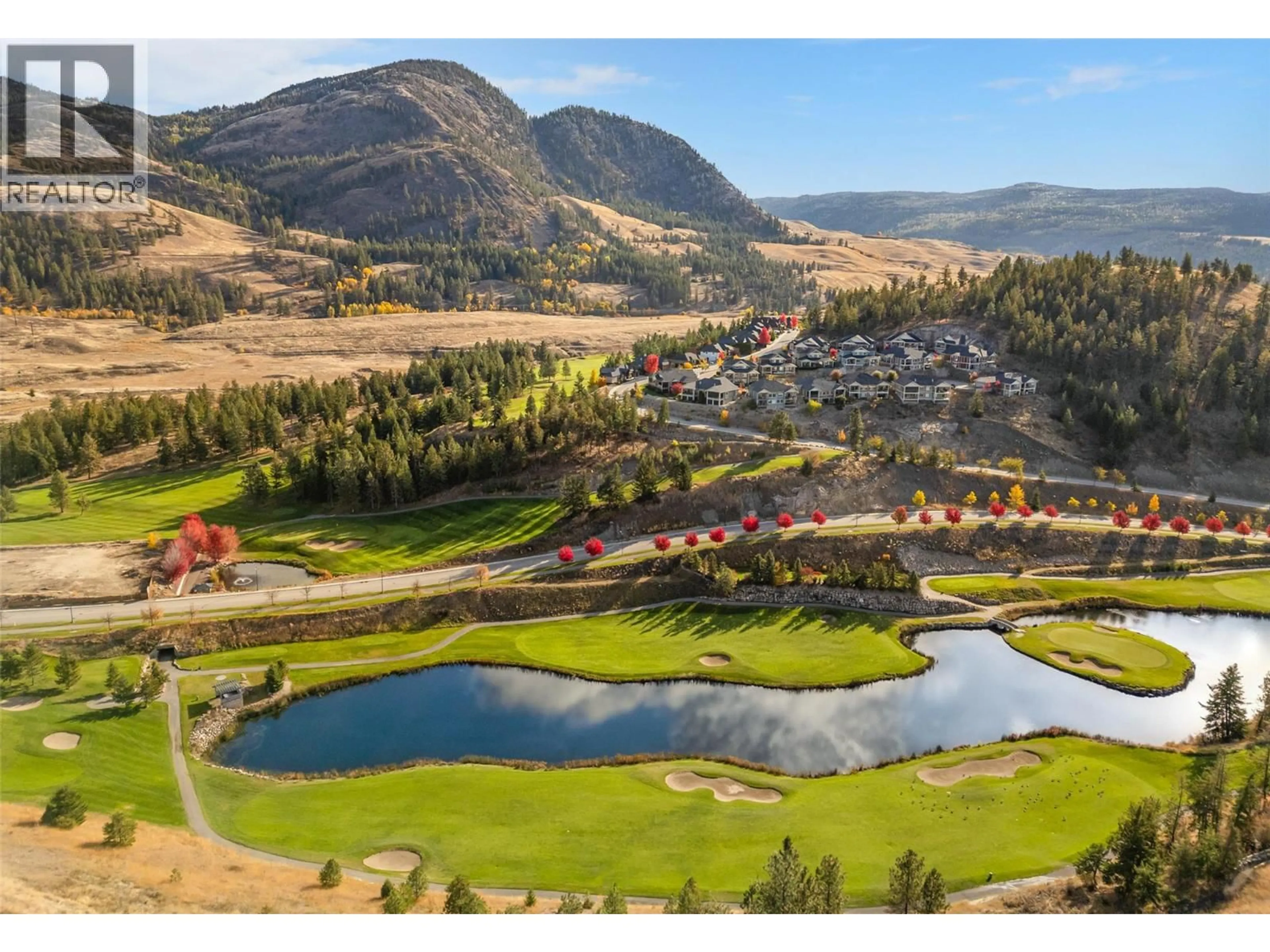 A pic from outside/outdoor area/front of a property/back of a property/a pic from drone, mountain view for 759 CARNOUSTIE DRIVE, Kelowna British Columbia V1P1V2