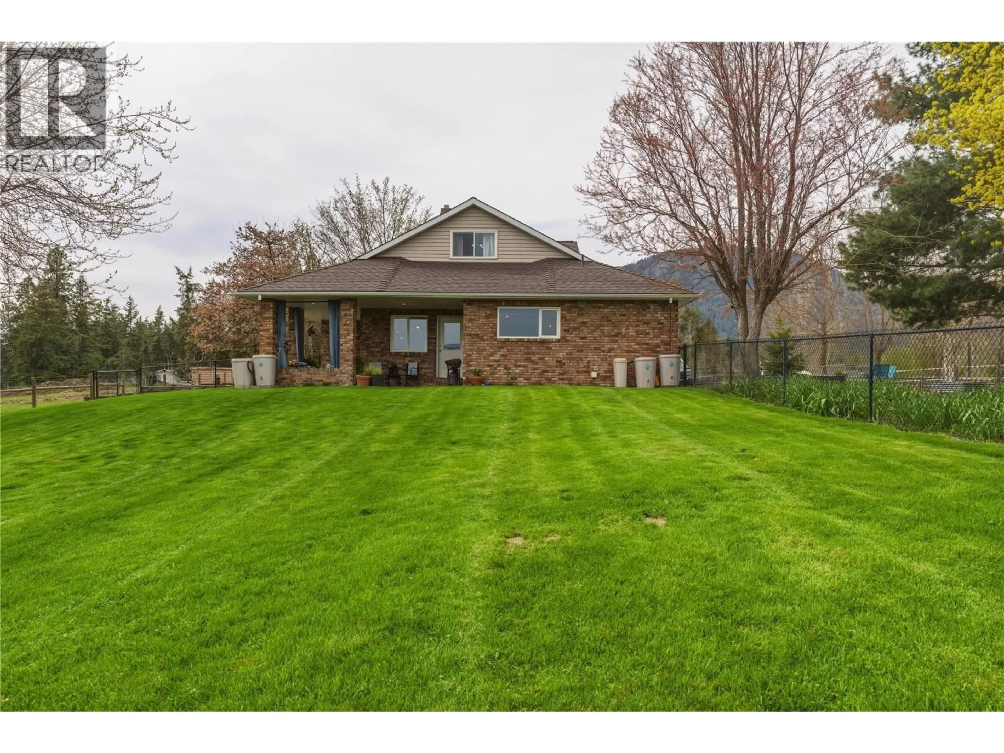 A pic from outside/outdoor area/front of a property/back of a property/a pic from drone, street for 5271 PYOTT ROAD, Spallumcheen British Columbia V4Y0M6